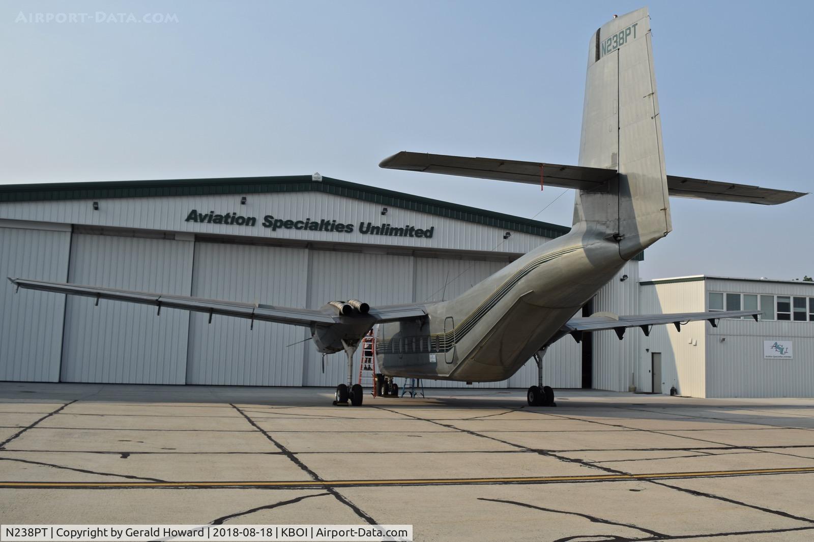 N238PT, 1965 De Havilland Canada DHC-4A Caribou C/N 238, The aircraft is level. The building distortion is from the lens I used.
