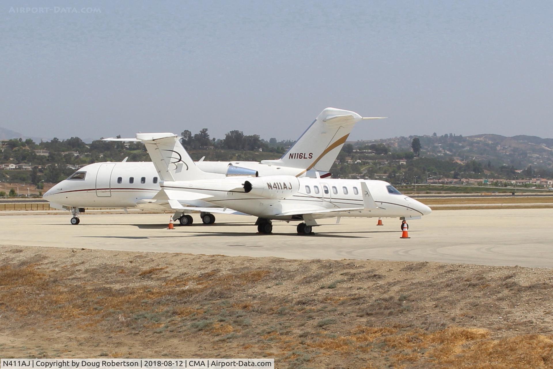 N411AJ, 2004 Learjet 40 C/N 40-2011, 2004 Bombardier Aerospace LEARJET 45, two Honeywell TFE731-20-1B turbofans flat rated at 3,500 lb st each with FADEC, on SUN AIR ramp in foreground.