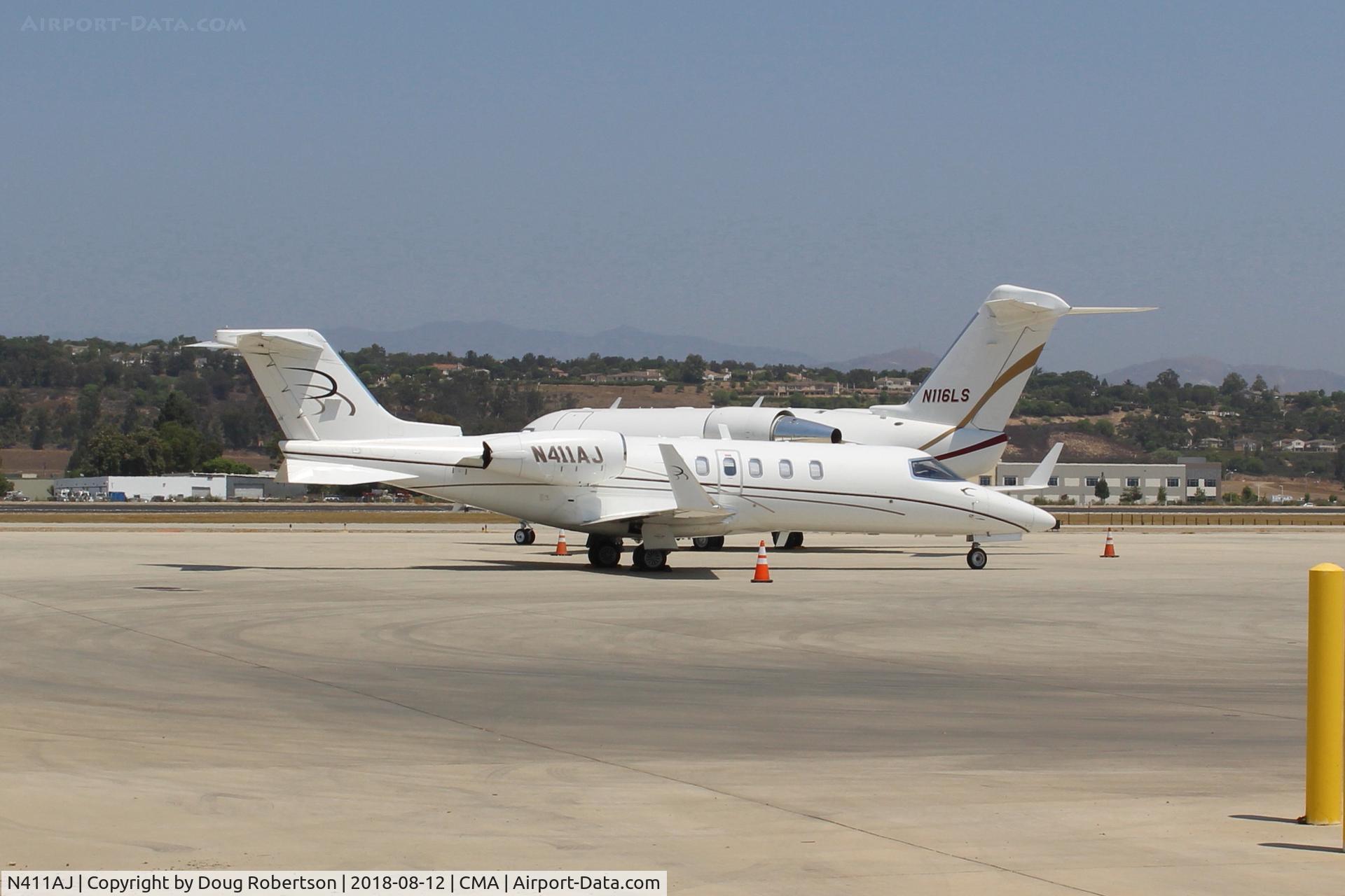 N411AJ, 2004 Learjet 40 C/N 40-2011, 2004 Bombardier Aerospace LEARJET 45, two Honeywell TFE731-20-1B turbofans flat rated at 3,500 lb st each with FADEC,  on SUNAIR Ramp in foreground