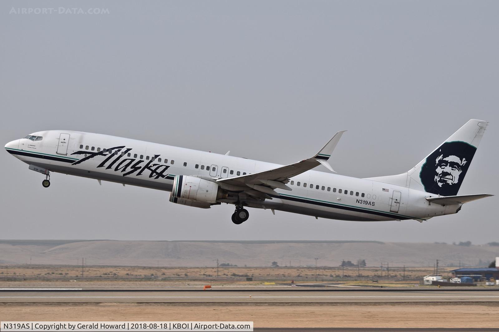 N319AS, 2003 Boeing 737-990 C/N 33679, Take off climb out from RWY 10L.