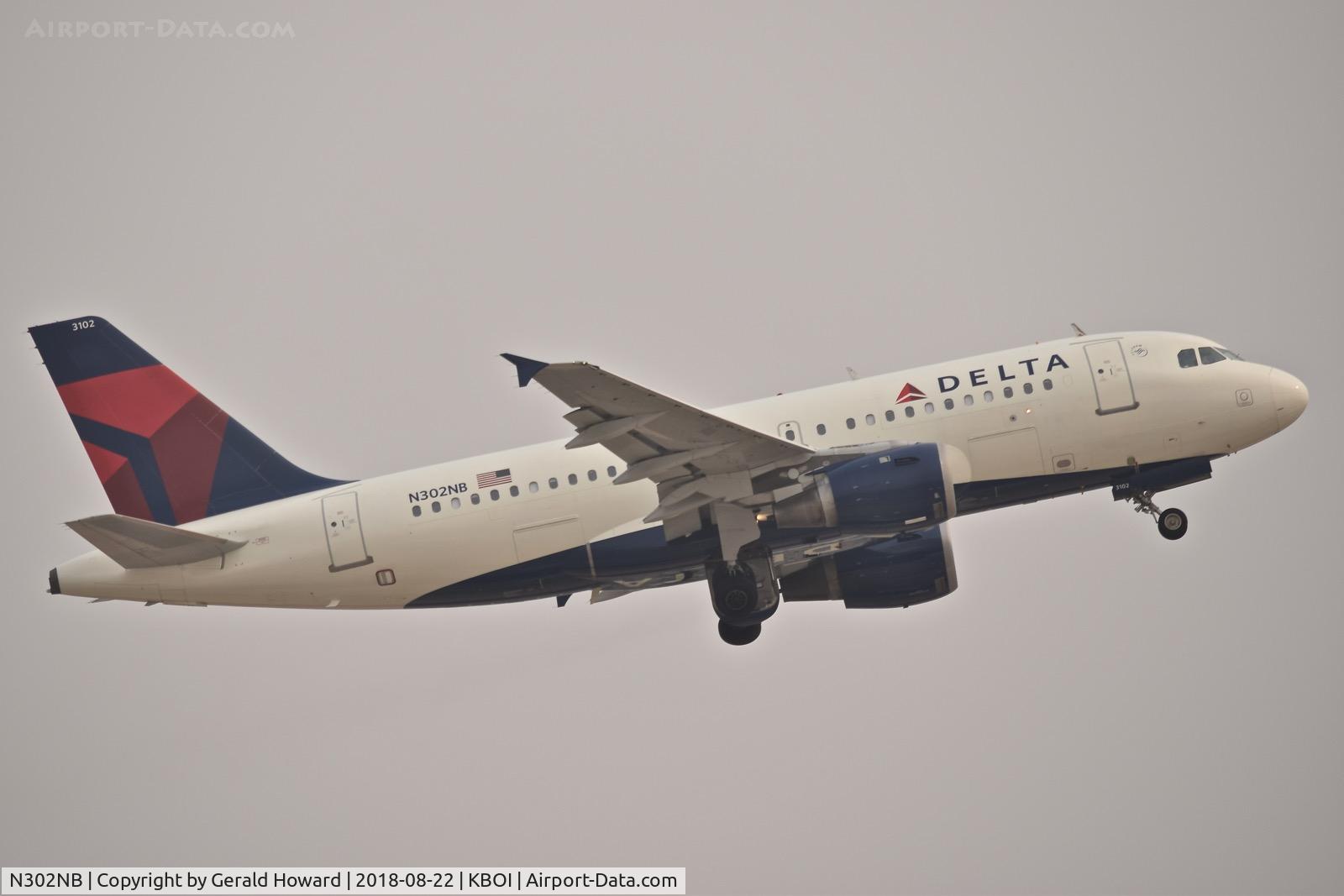 N302NB, 1999 Airbus A319-114 C/N 1062, Climb out from RWY 10L on a 4 mile haze/smoke day.