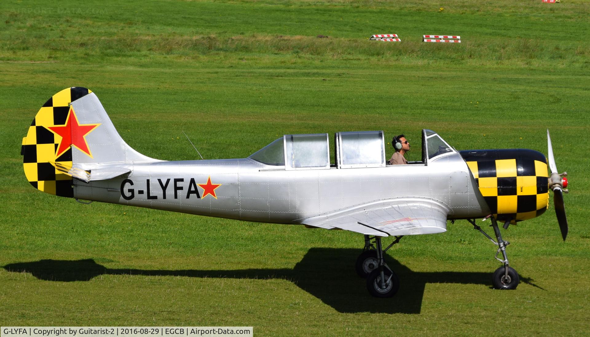 G-LYFA, 1982 Yakovlev Yak-52 C/N 822608, At City Airport Manchester