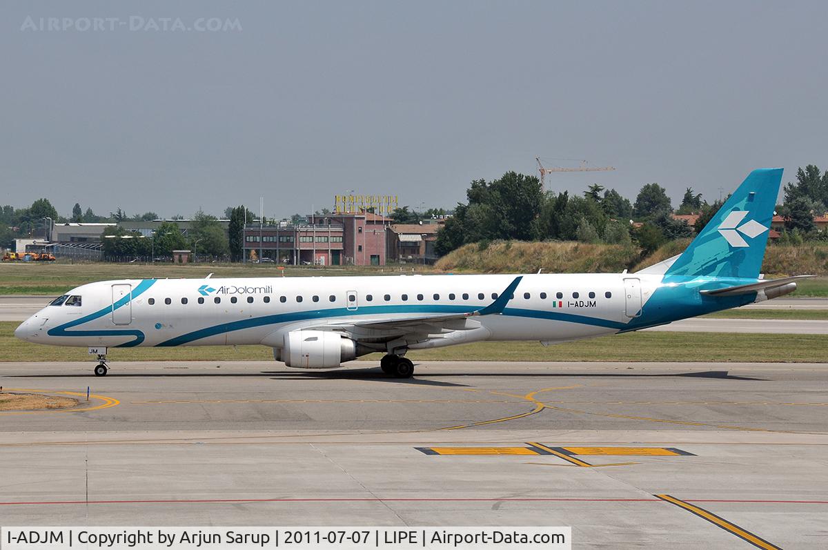 I-ADJM, 2009 Embraer 195LR (ERJ-190-200LR) C/N 19000258, Taxiing by at Guglielmo Marconi Airport.