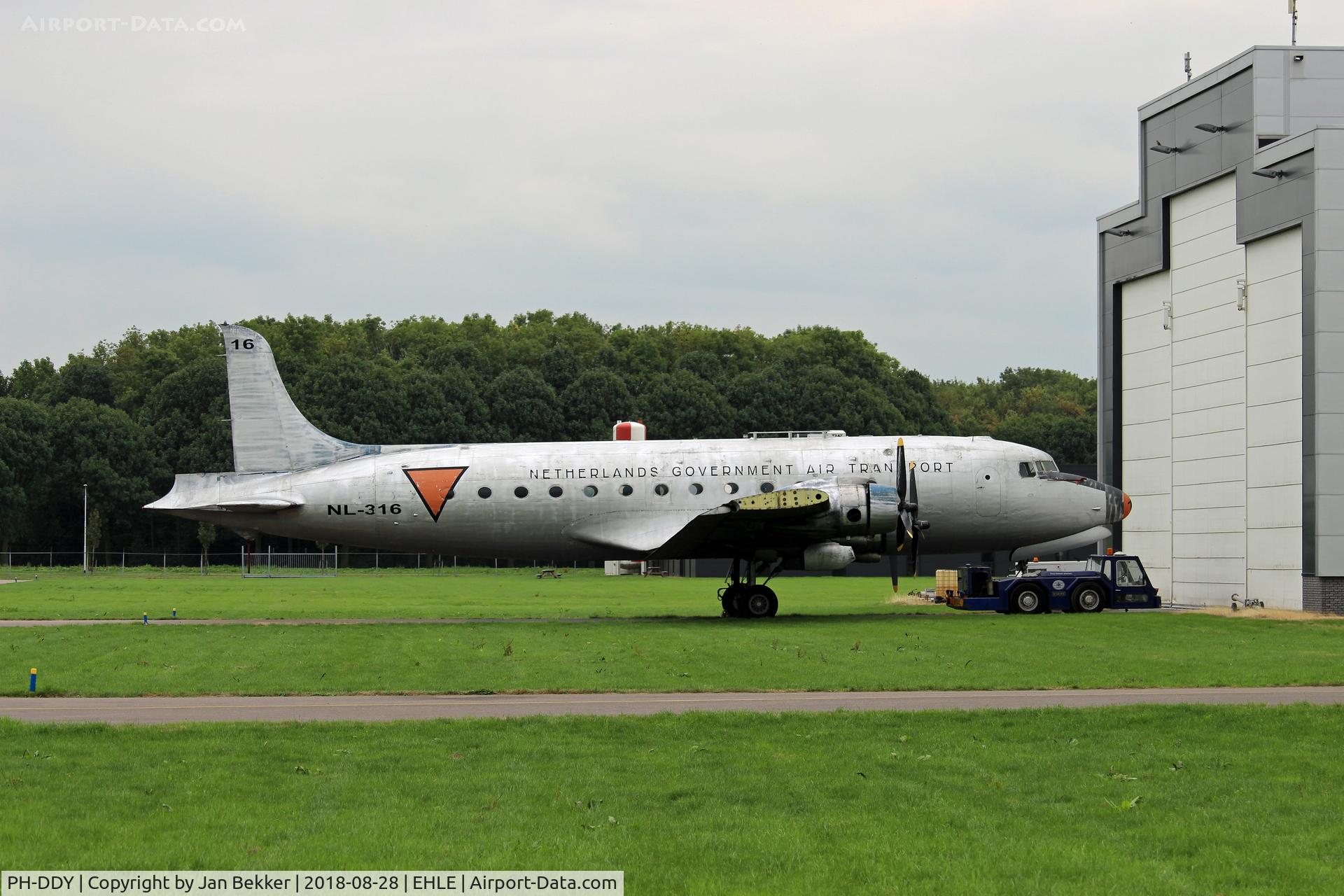 PH-DDY, 1942 Douglas C-54A Skymaster C/N 7488, Lelystad Airport. In front of the Satys (Sealing & Painting) hangar. The plane, owned by the Aviodrome Museum at Lelystad Airport will get a new livery (Old KLM colourscheme)