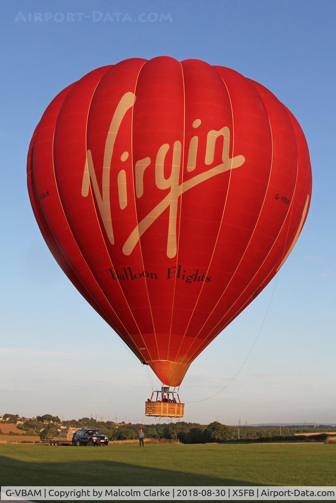 G-VBAM, 2015 Cameron A-400 C/N 11872, Cameron A-400 of Virgin Balloon Flights lifts of from Fishburn Airfield in the late evening sunlight.