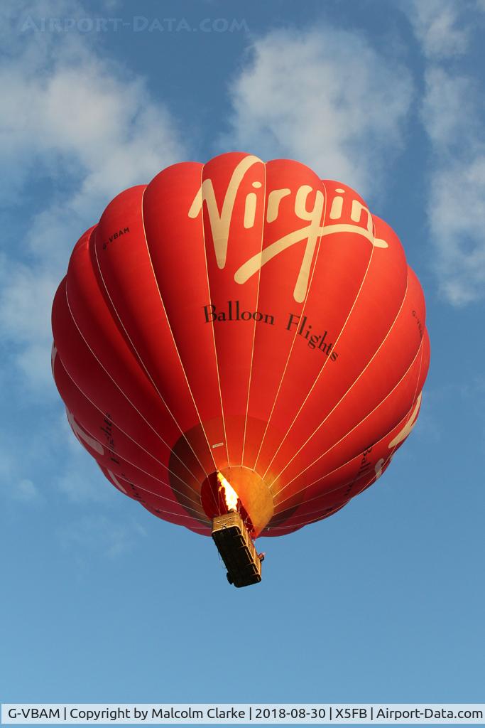 G-VBAM, 2015 Cameron A-400 C/N 11872, Cameron A-400 of Virgin Balloon Flights lifts of from Fishburn Airfield in the late evening sunlight.