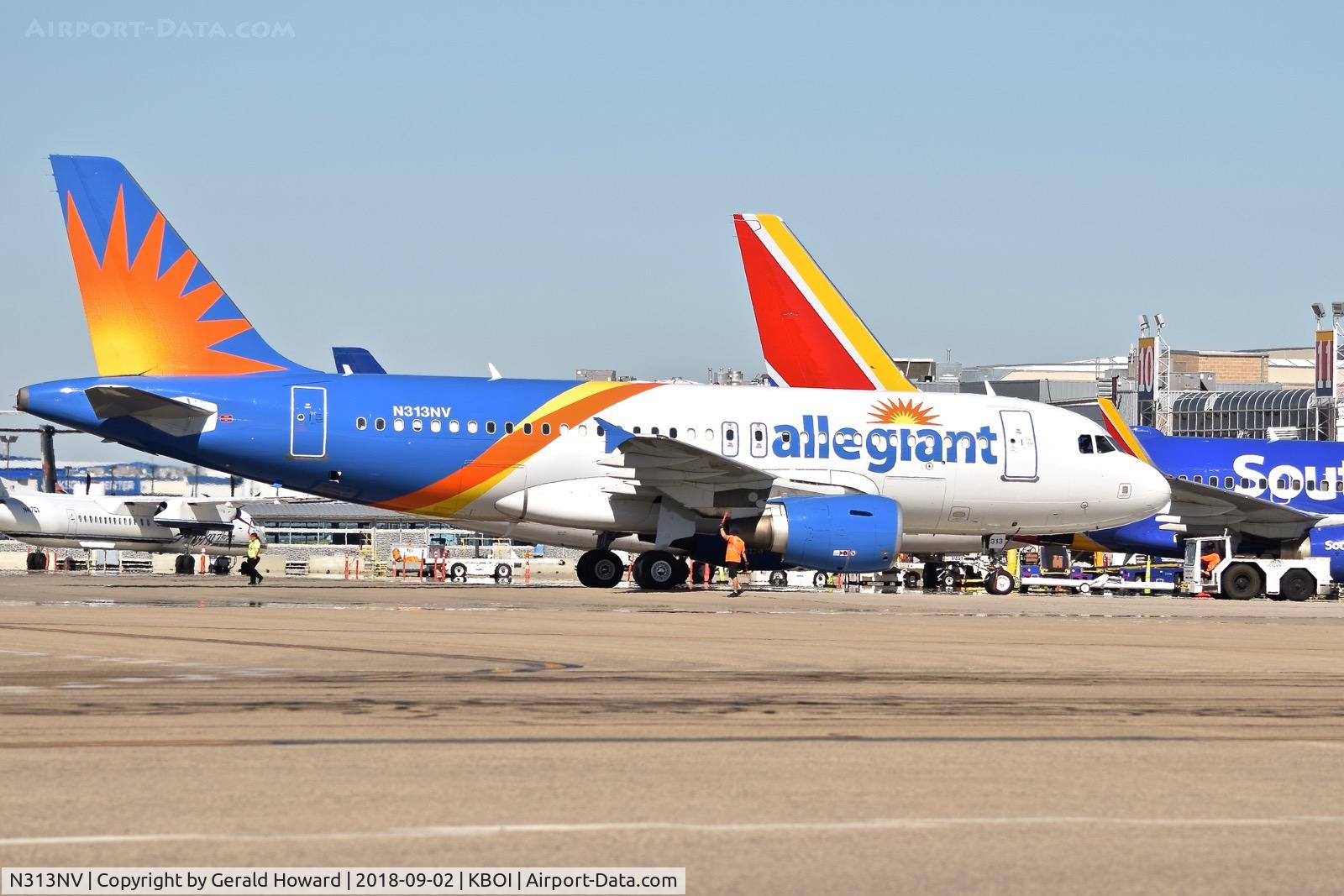 N313NV, 2004 Airbus A319-111 C/N 2300, Push back from the gate.