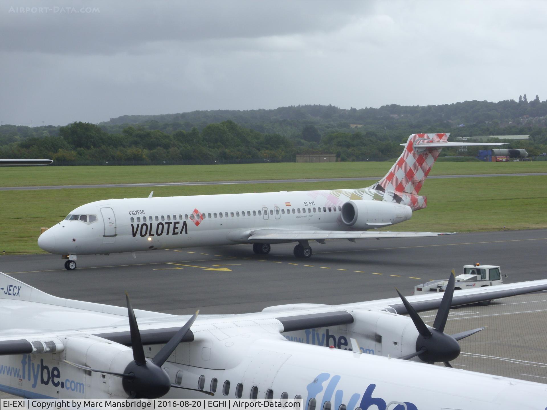 EI-EXI, 2003 Boeing 717-2BL C/N 55174, Taxiing for departure at Southampton airport EGHI. Photo taken from the multistory carpark