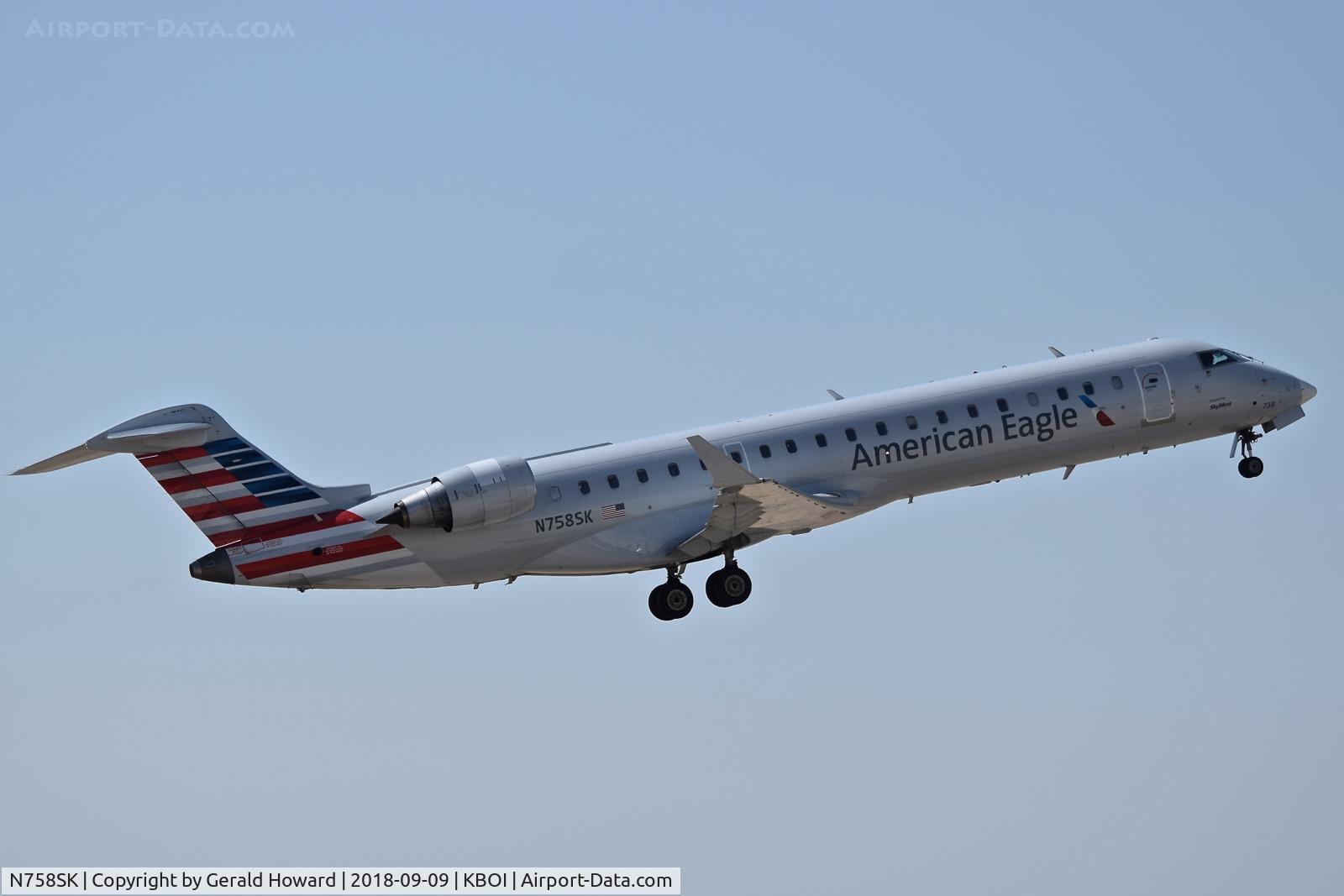 N758SK, 2005 Bombardier CRJ-701ER (CL-600-2C10) Regional Jet C/N 10222, Climb out from RWY 28R.