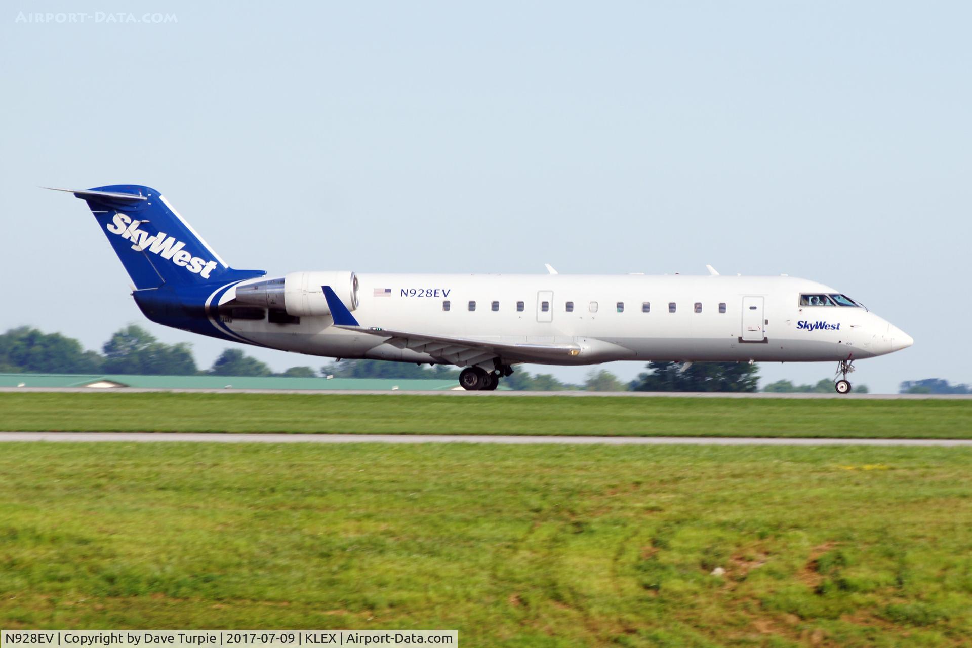 N928EV, 2004 Bombardier CRJ-200LR (CL-600-2B19) C/N 8006, After taking pictures at dozens of airports, KLEX has the best place to get a great angle.  Unfortunately, it's a little slower thatn KMIA or KLAX.