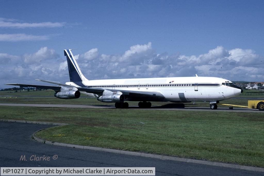 HP1027, 1963 Boeing 707-373C C/N 18709, Photographed at Prestwick Airport , Scotland as the aircraft was being 'tugged' from a stand to the Orangefield parking area. 
Assume the serial is 'Flag of Convenience'