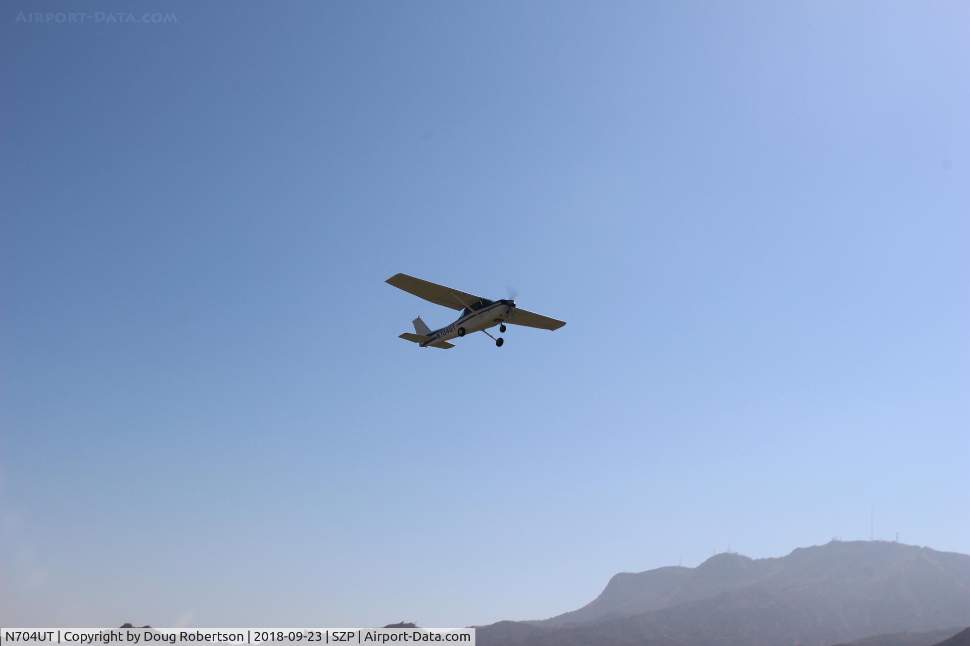 N704UT, 1976 Cessna 150M C/N 15078891, 1976 Cessna 150M, Continental O-200 100 Hp, another takeoff climb Rwy 22.