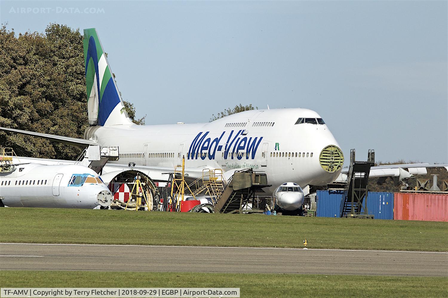 TF-AMV, 1996 Boeing 747-412 C/N 28022, With Air Salvage International for parting out at Cotswold Airport  Kemble , UK ; under the nose of the B747 is the remains of bizjet L1329 - HB-JGK
