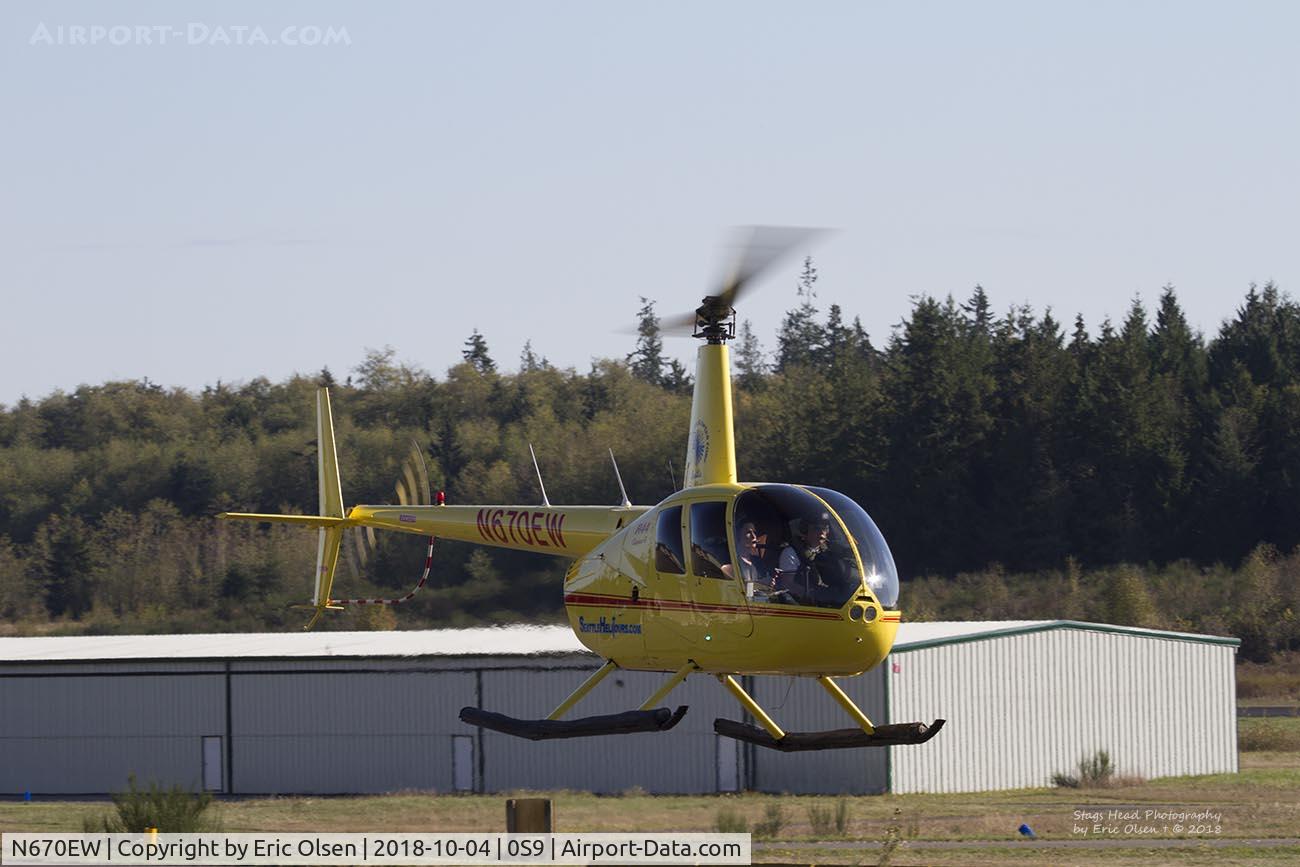 N670EW, Robinson R44 Raven II C/N 12849, R44 about to go past the Spruce Goose Cafe