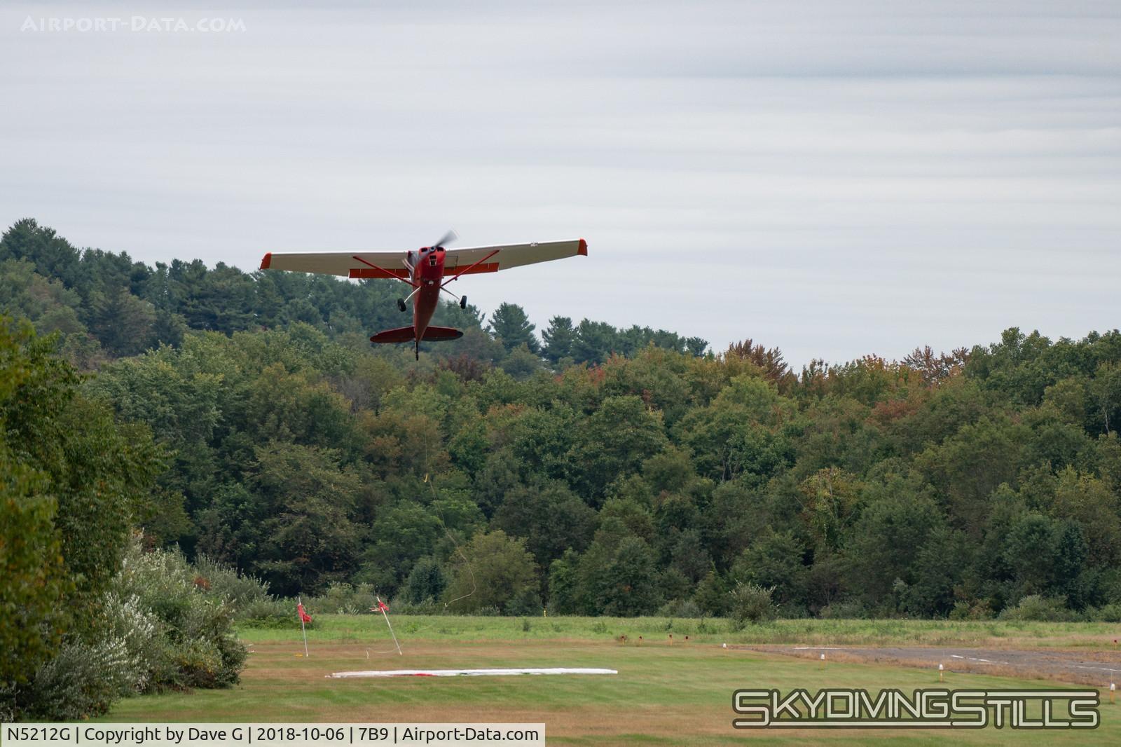N5212G, 1950 Cessna 305A C/N 21201, Snagging a banner at Ellington, CT