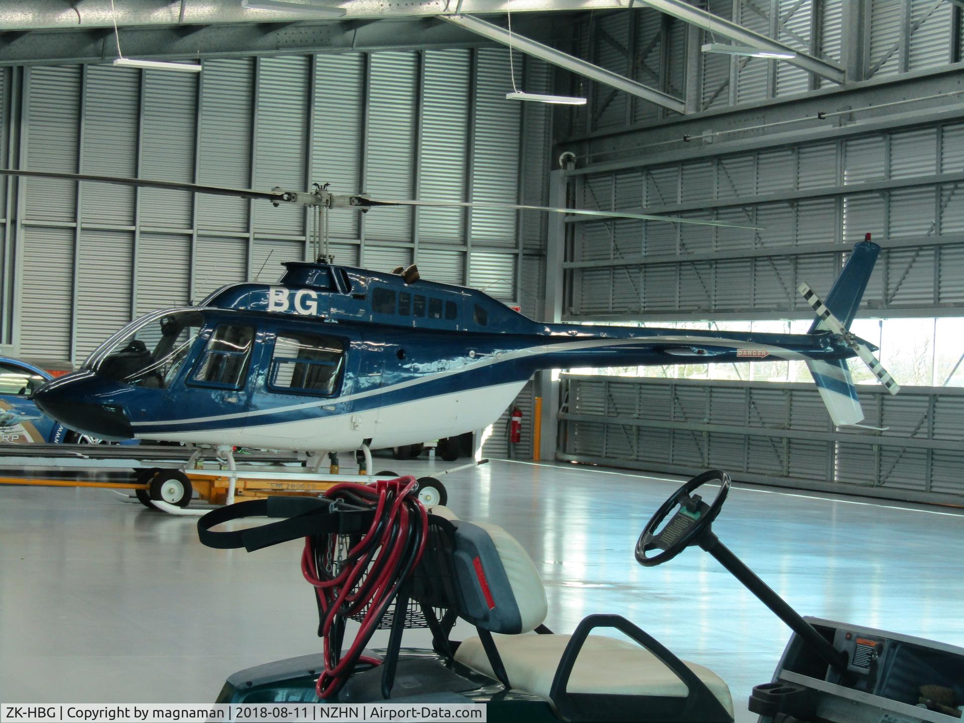 ZK-HBG, Bell 206B C/N 3941, in hangar by terminal - handy large glass windows!