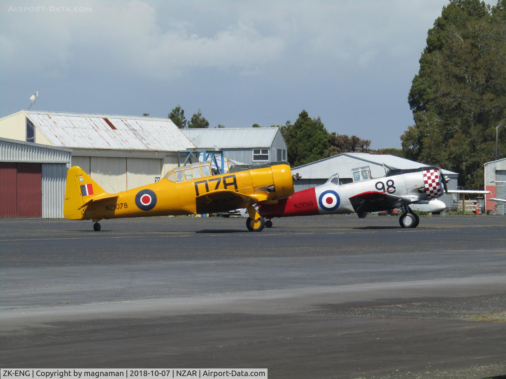 ZK-ENG, 1941 North American AT-6D Harvard III C/N 88-15873 (41-34119), and NZ1098 behind - outside warbird hangar