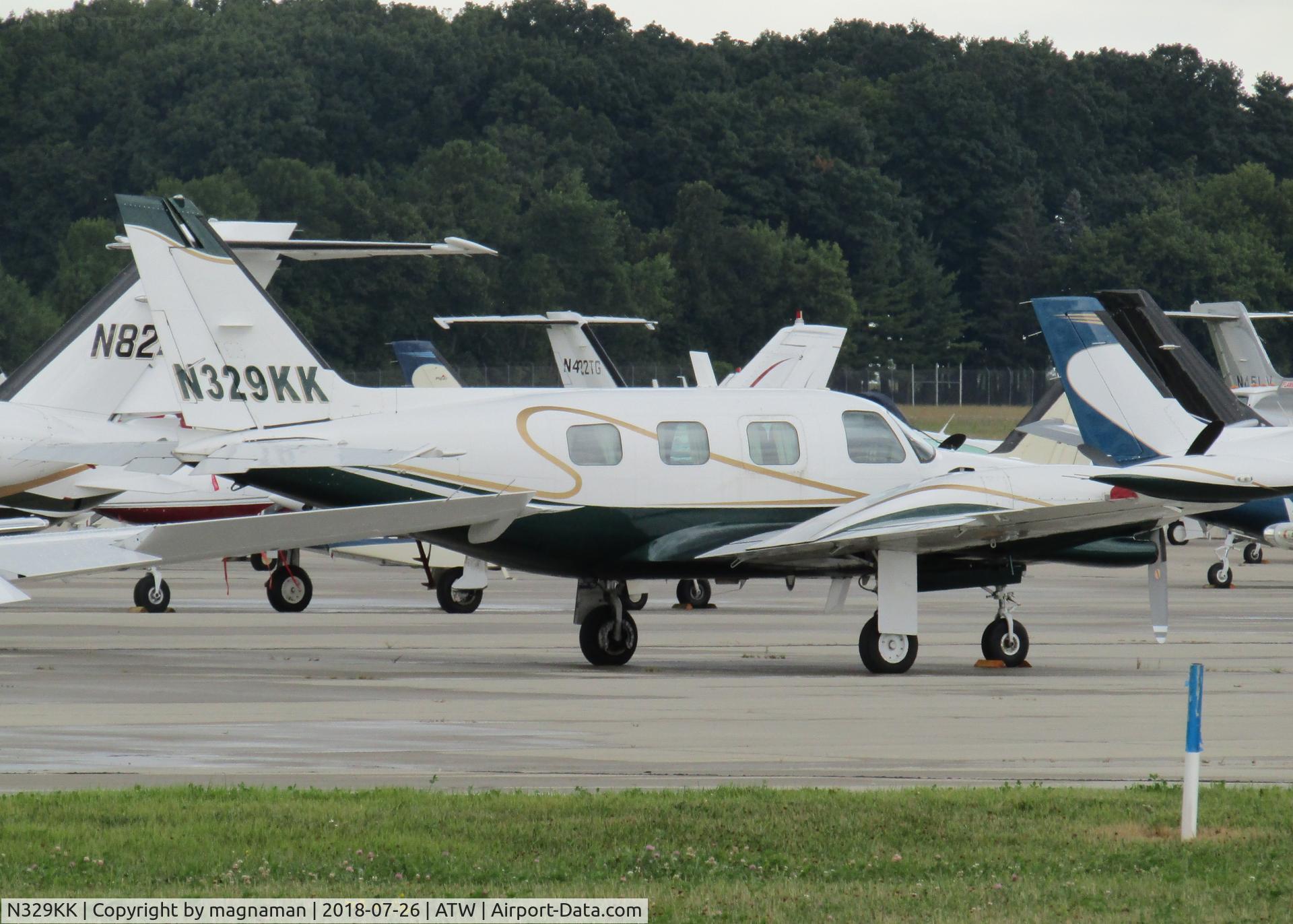 N329KK, 1980 Piper PA-31T1 Cheyenne 1 C/N 31T-8104011, at a crowded ramp for EAA 18
