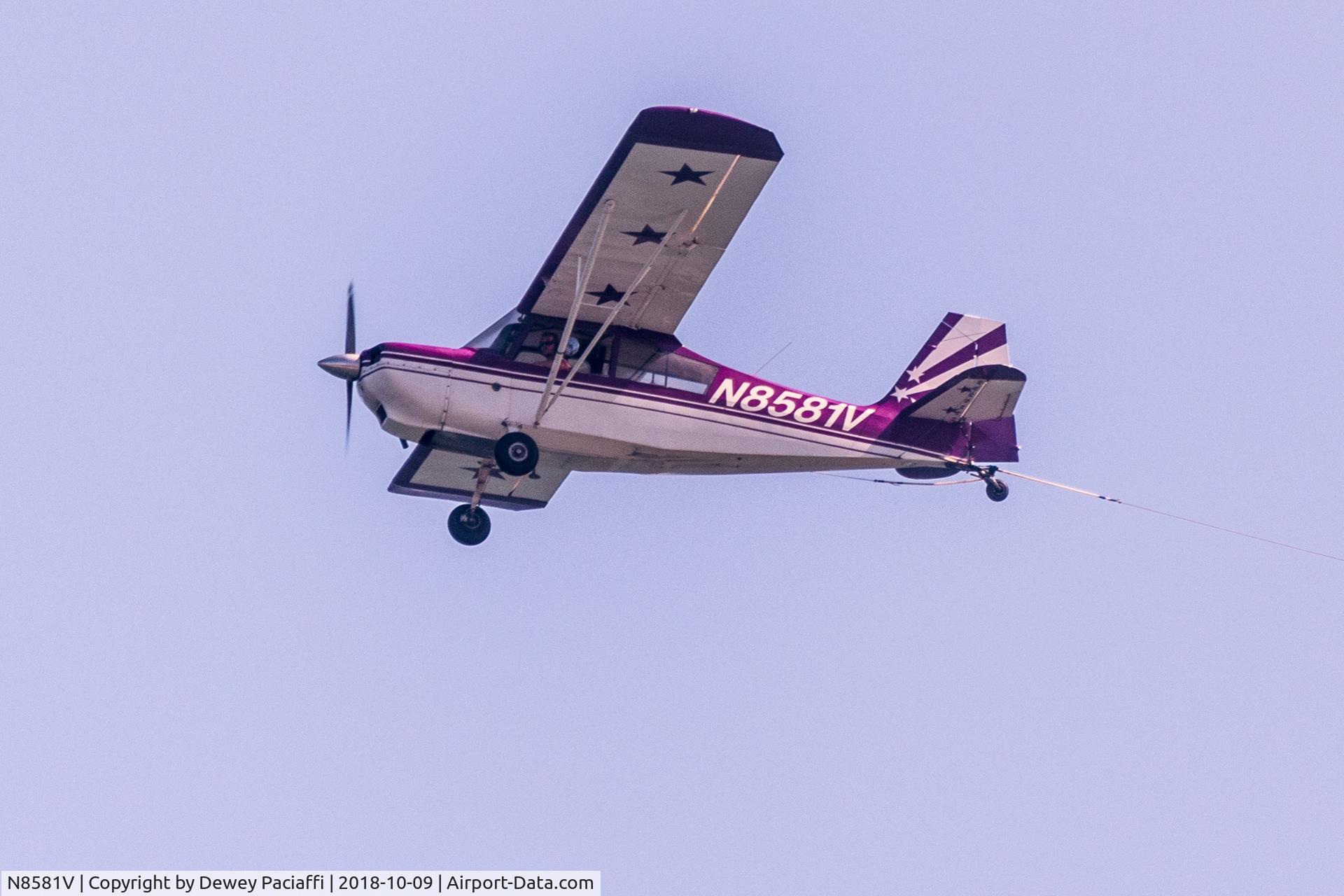N8581V, 1975 Bellanca 7GCBC C/N 805-75, Photographed over the beach in Nags Head, NC. Pulling a sign.