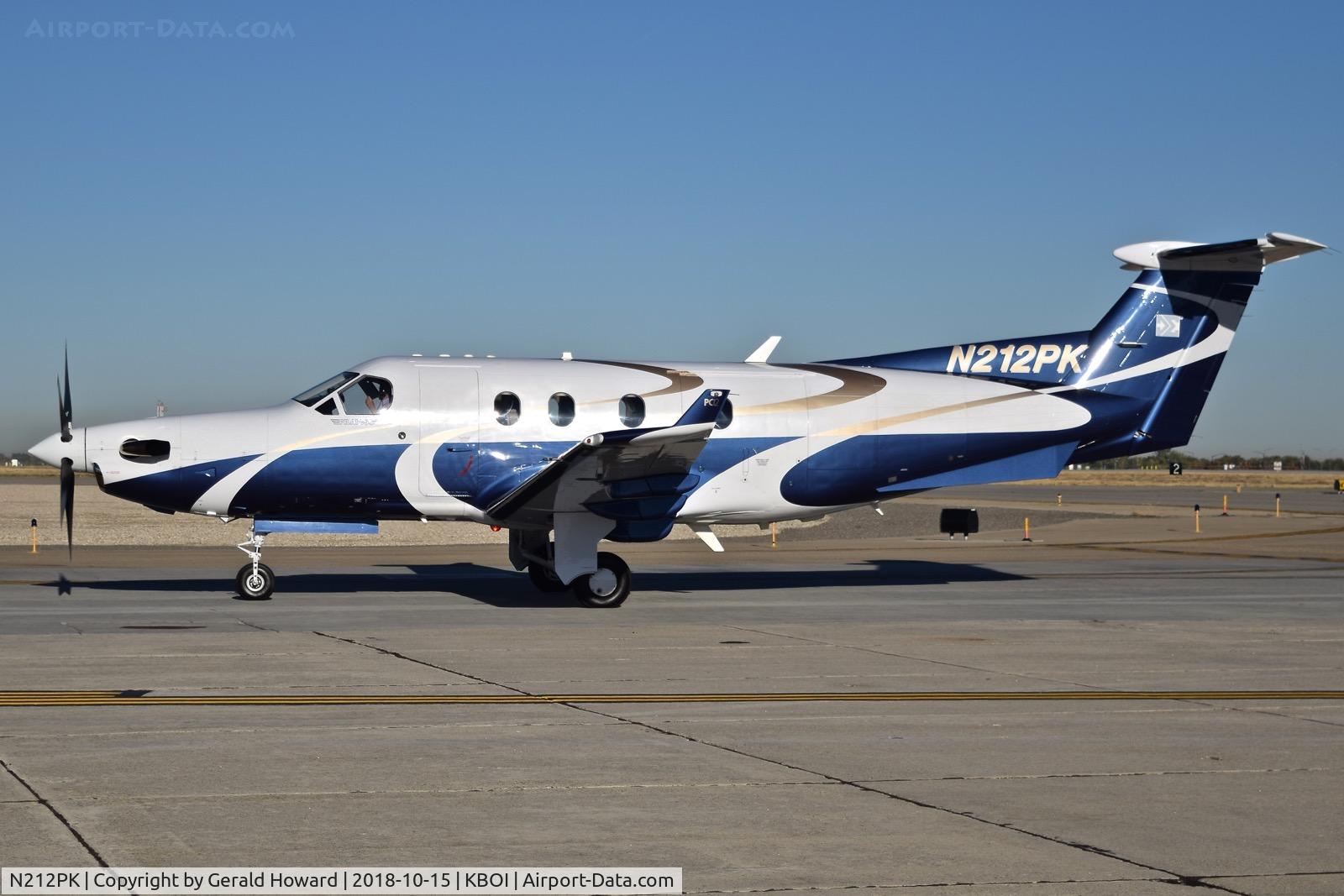 N212PK, 2005 Pilatus PC-12/45 C/N 668, Taxiing to the south GA ramp.