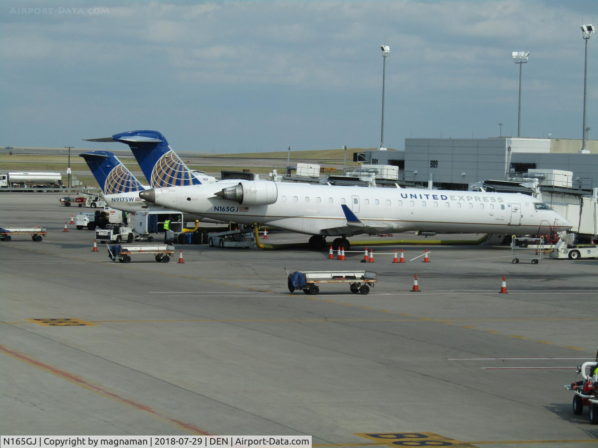 N165GJ, 2006 Bombardier CRJ-700 (CL-600-2C10) Regional Jet C/N 10257, on stand at DEN