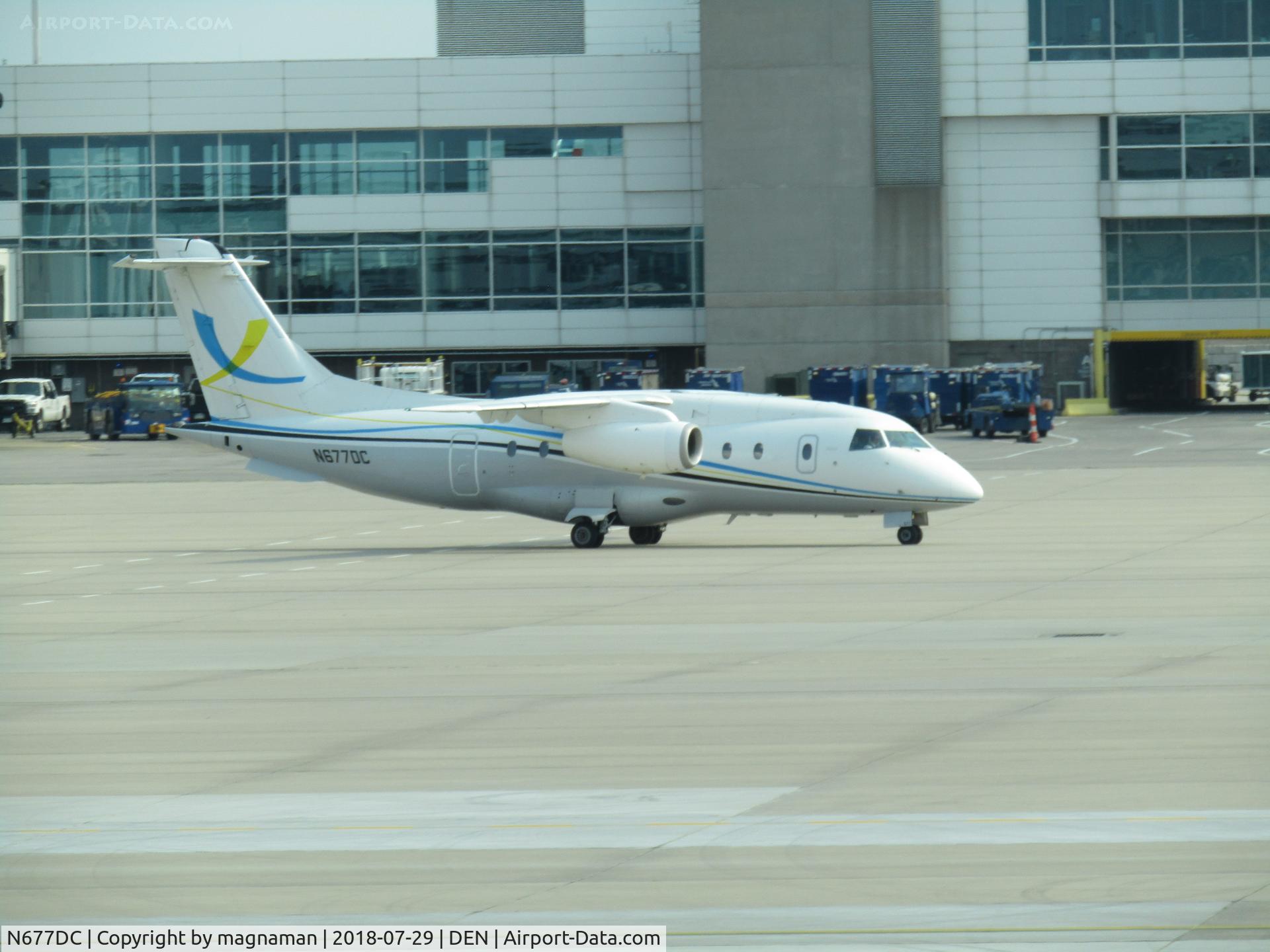 N677DC, 1999 Fairchild Dornier 328-300 328JET C/N 3126, taxing out at DEN