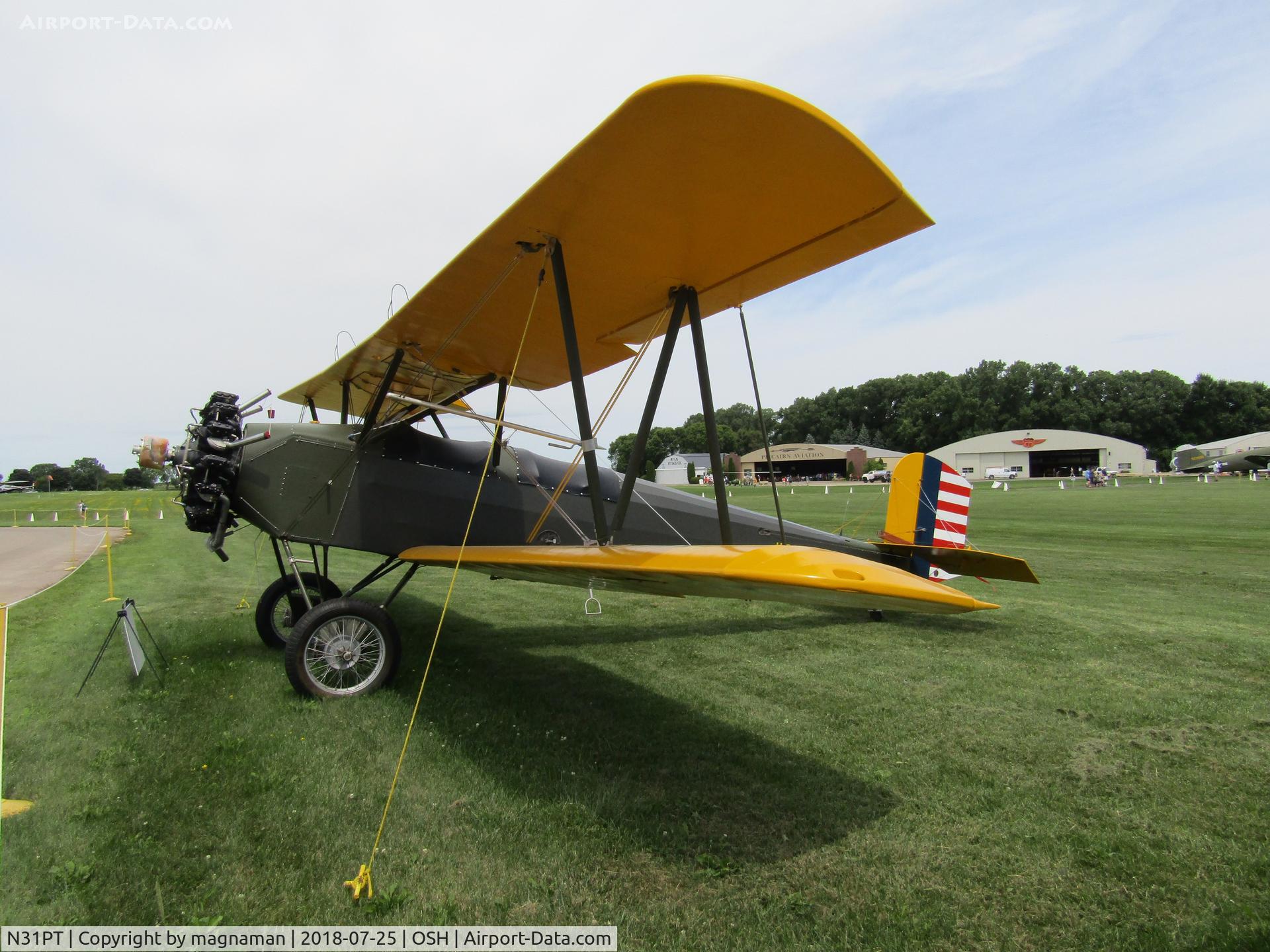 N31PT, 1998 Consolidated PT-3 Replica C/N 1, on grass at EAA