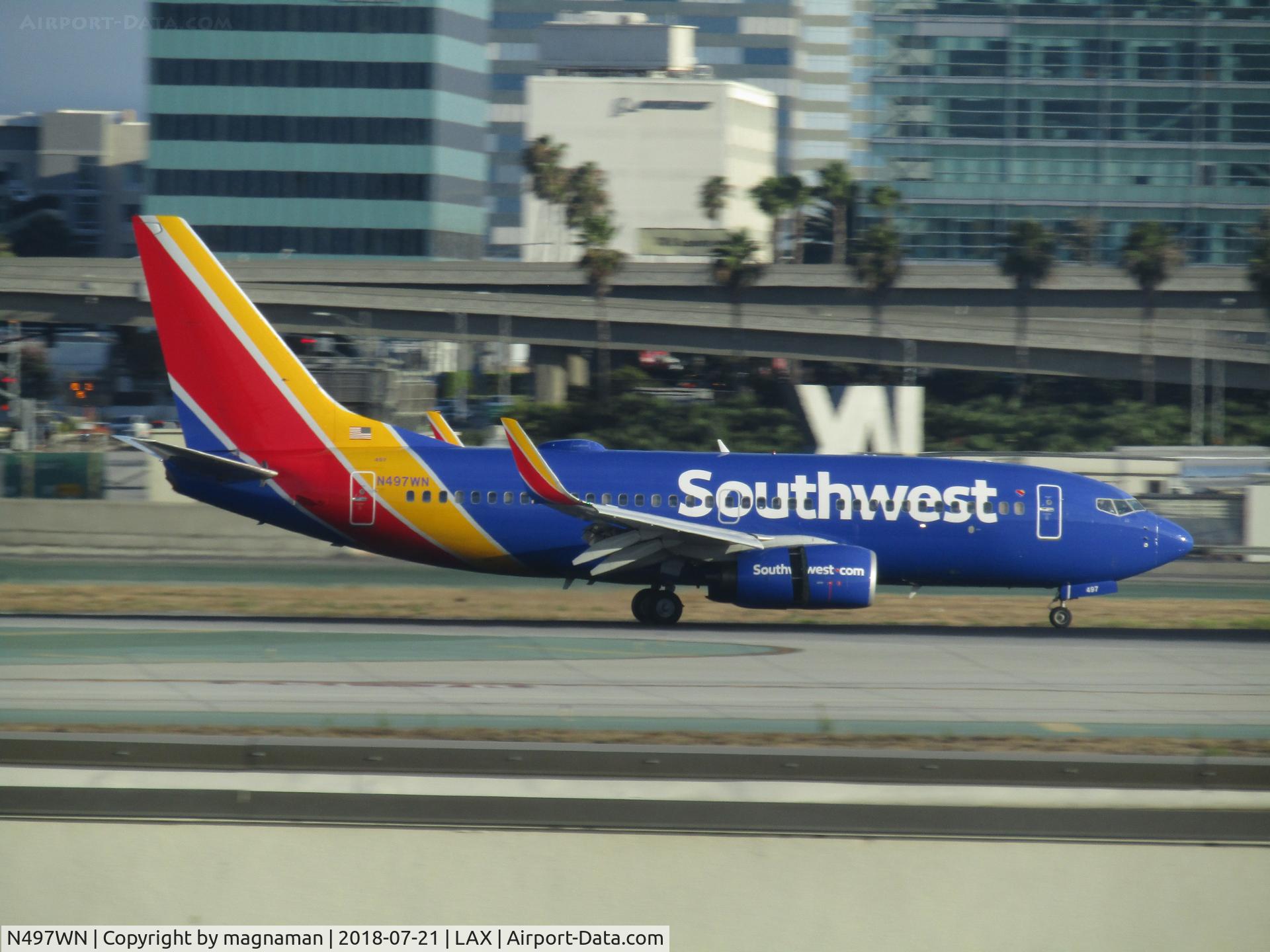 N497WN, 2004 Boeing 737-7H4 C/N 32479, colourful airline