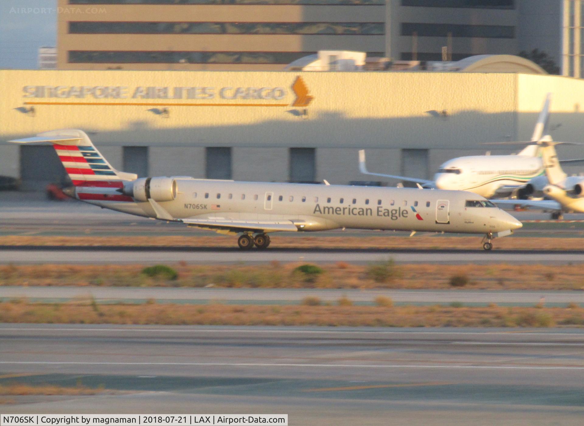 N706SK, 2004 Bombardier CRJ-701 (CL-600-2C10) Regional Jet C/N 10149, dusk arrival at LA