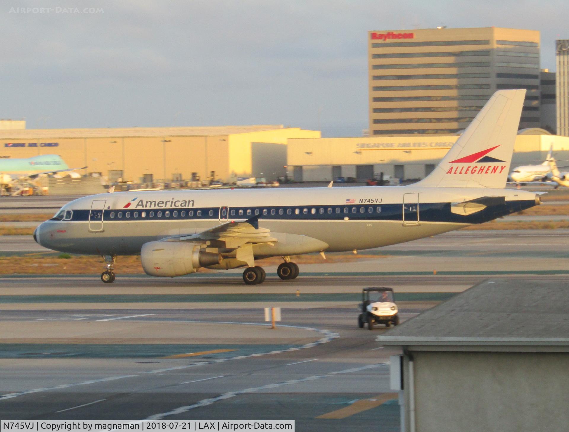 N745VJ, 2000 Airbus A319-112 C/N 1289, leaving LA at dusk - nice retro scheme