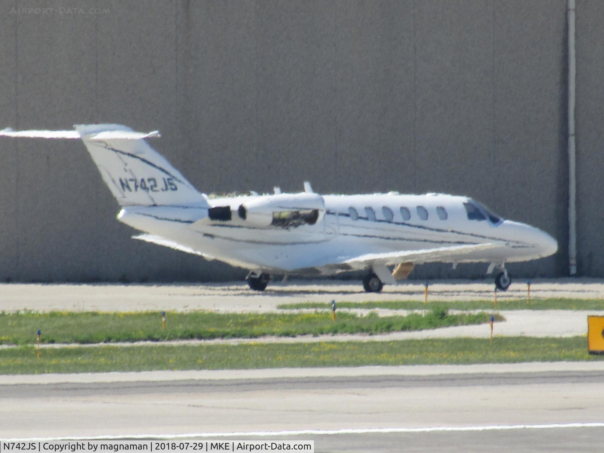 N742JS, Cessna 525A C/N 525A-0241, long range shot from car park at MKE
