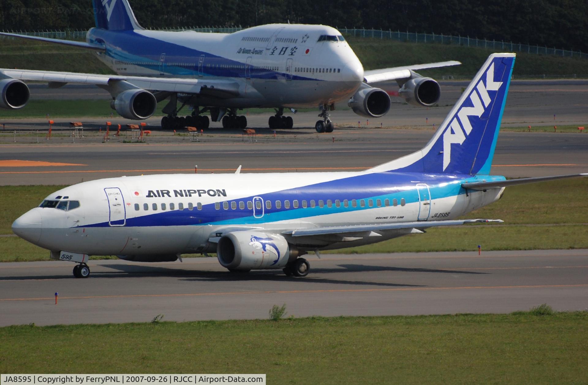 JA8595, 1997 Boeing 737-54K C/N 28461, Arrival of Air nippon B735 with larger company plane behind it.