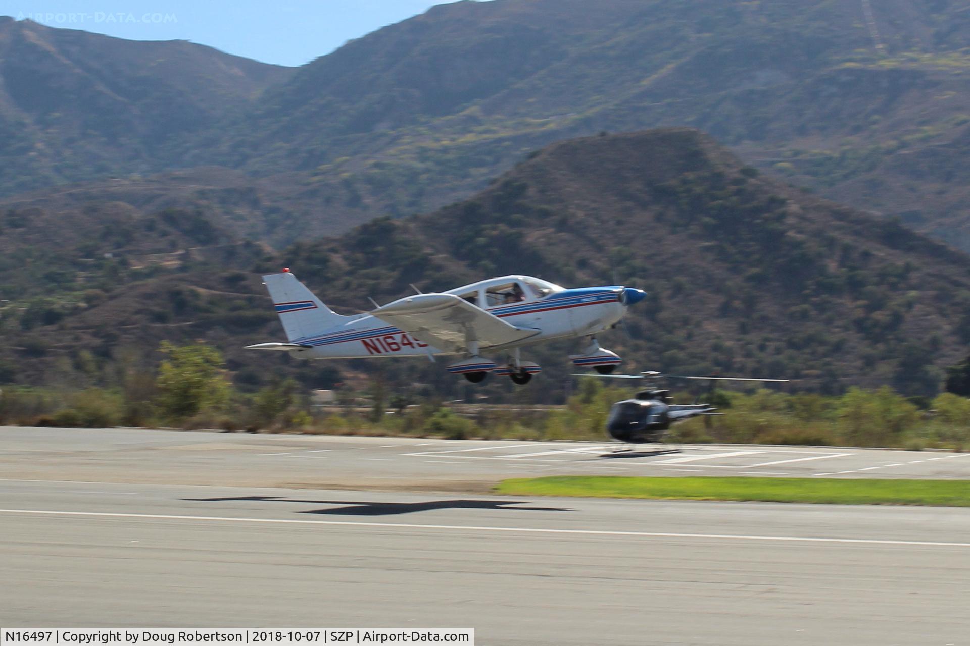 N16497, 1973 Piper PA-28-235 Cherokee Charger C/N 28-7310101, 1973 Piper PA-28-235 CHARGER, Lycoming O-540-D4B5 235 Hp, takeoff climb Rwy 22, Young Eagles flight