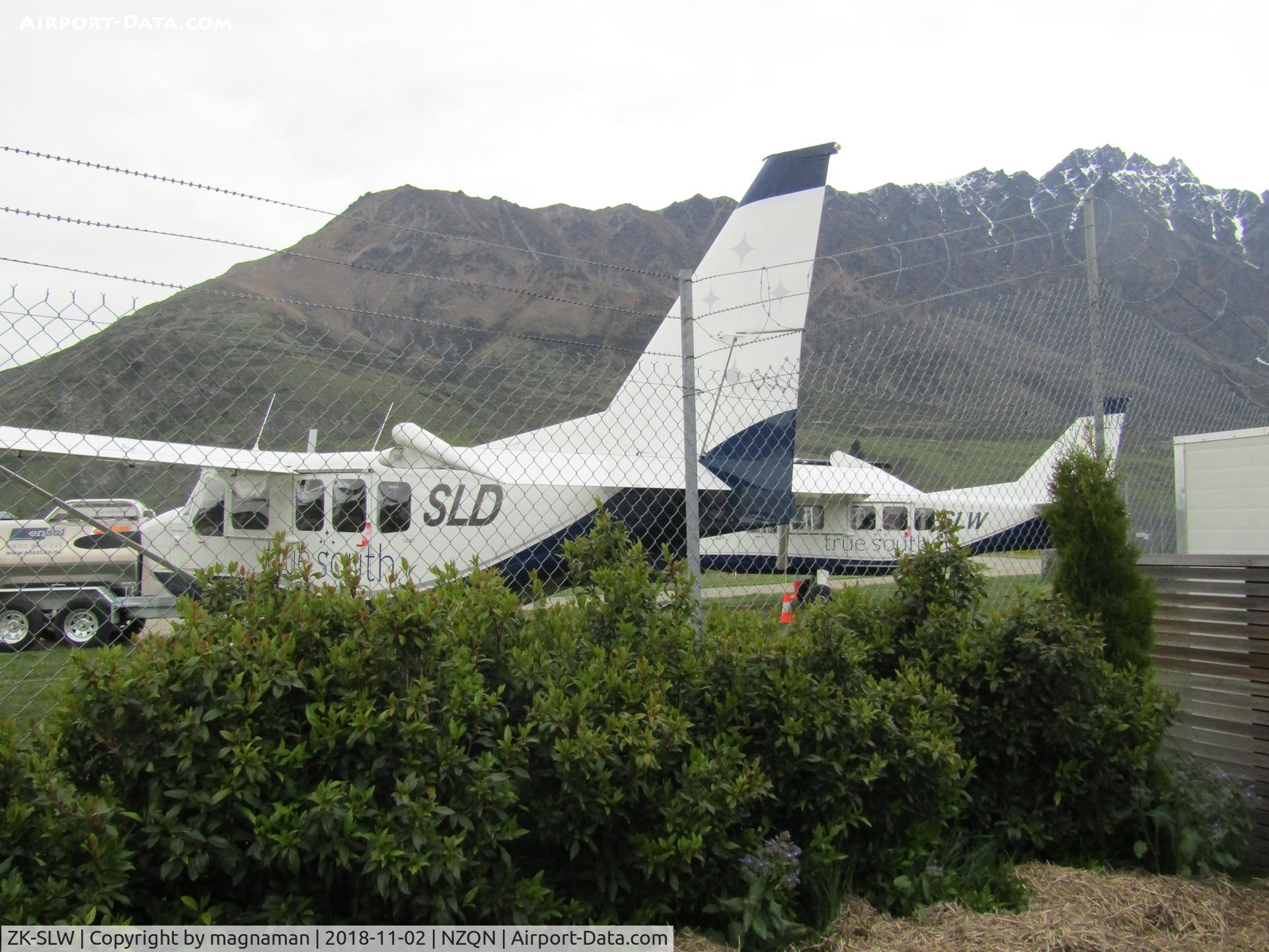ZK-SLW, 2008 Gippsland GA-8 Airvan C/N GA8-08-136, taken from cafe outside seating area - about 10 to 15 min walk from terminal around other side of airfield