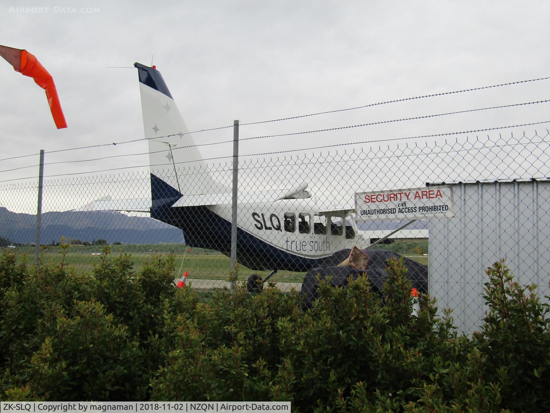 ZK-SLQ, Gippsland GA-8 Airvan C/N GA8-03-040, from cafe seating area opposite terminal side of airfield