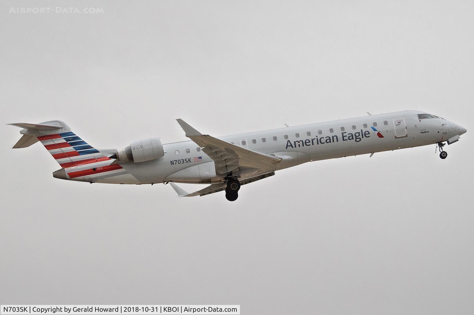 N703SK, 2004 Bombardier CRJ-701ER (CL-600-2C10) Regional Jet C/N 10139, Departing BOI.