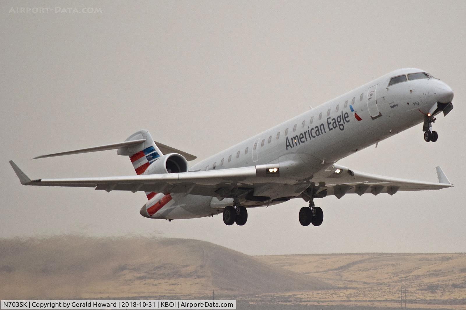 N703SK, 2004 Bombardier CRJ-701ER (CL-600-2C10) Regional Jet C/N 10139, Climb out from RWY 28R.