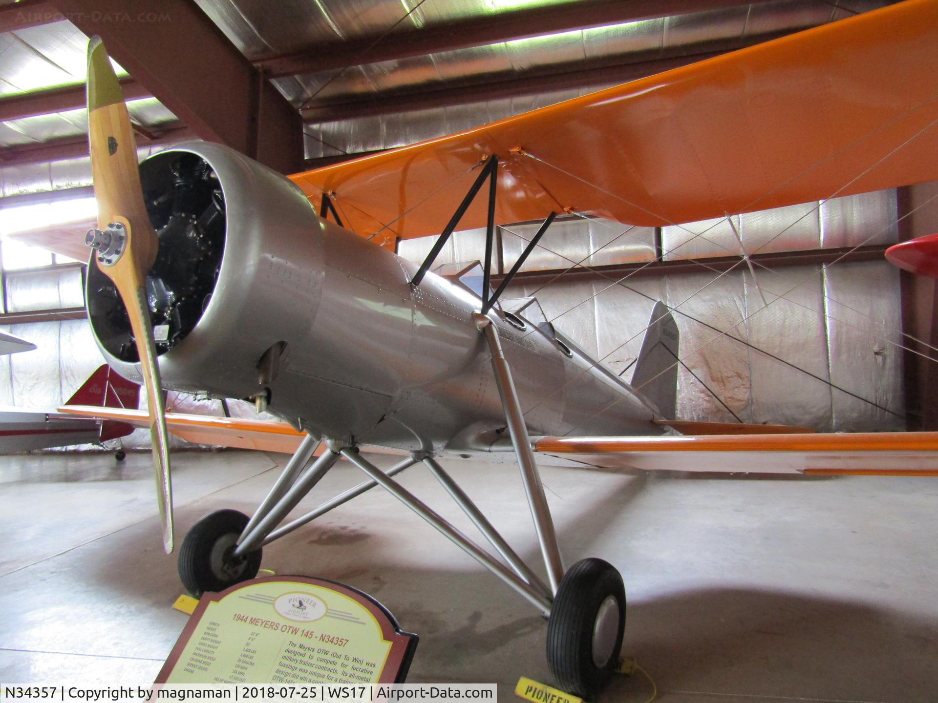 N34357, 1944 Meyers OTW-145 C/N 102, could not get far enough away for clear shot - very crowded hangars