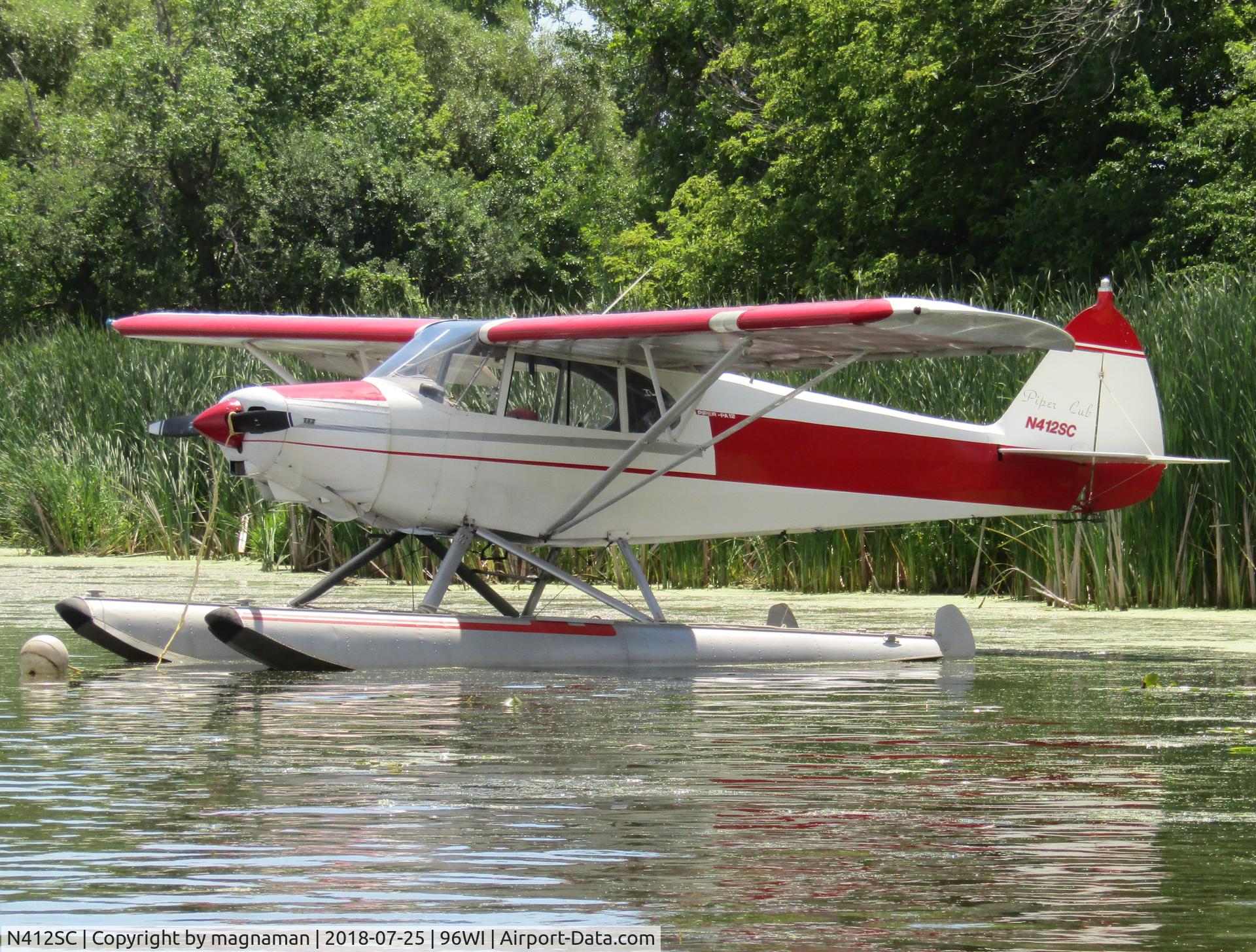 N412SC, 1946 Piper PA-12 Super Cruiser C/N 12-868, at osh sea plane base