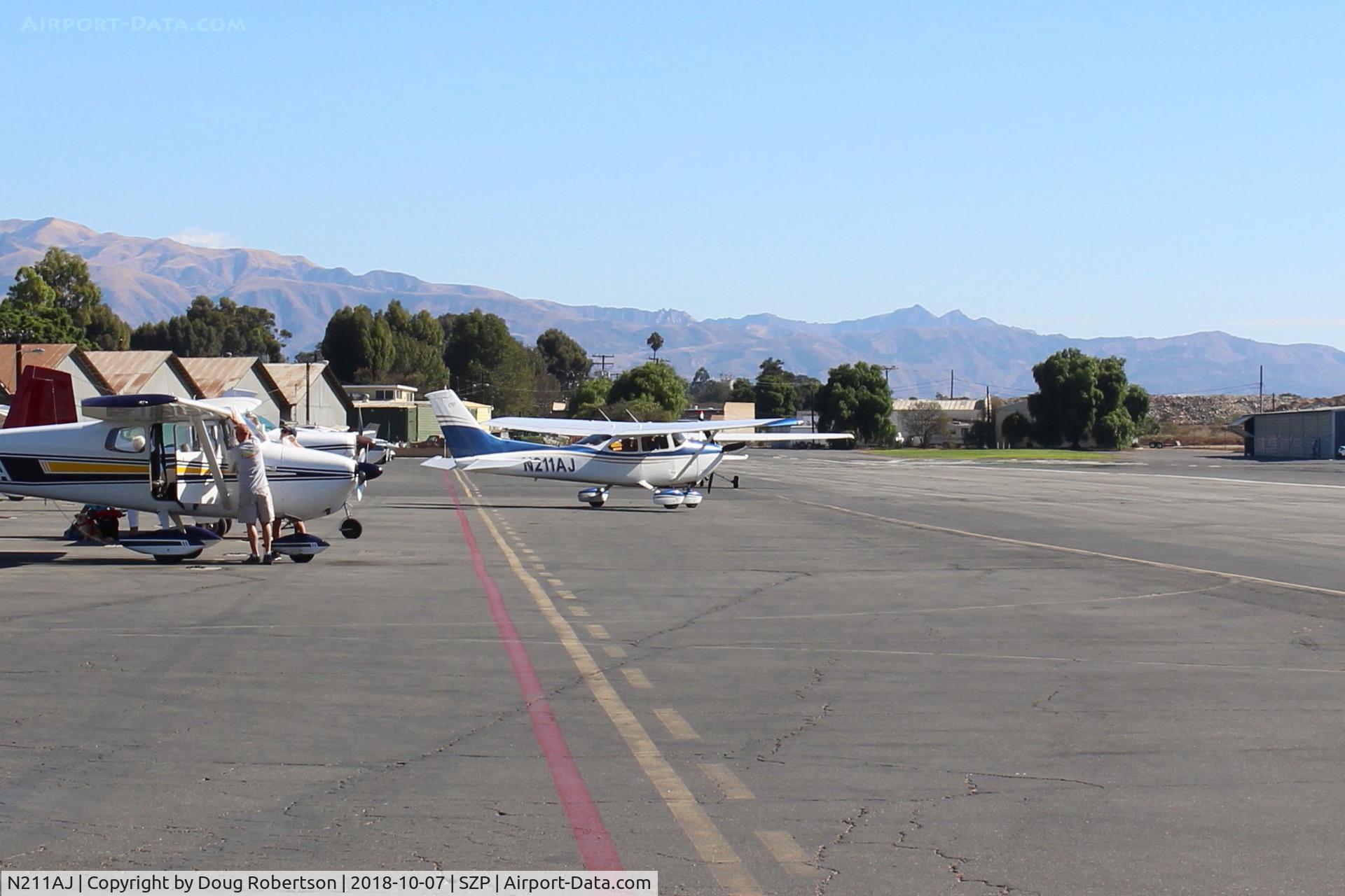 N211AJ, 1977 Cessna 182Q Skylane C/N 18265580, 1977 Cessna 182Q SKYLANE, Continental O-470-U 230 Hp, spotting the aircraft on Transient Ramp