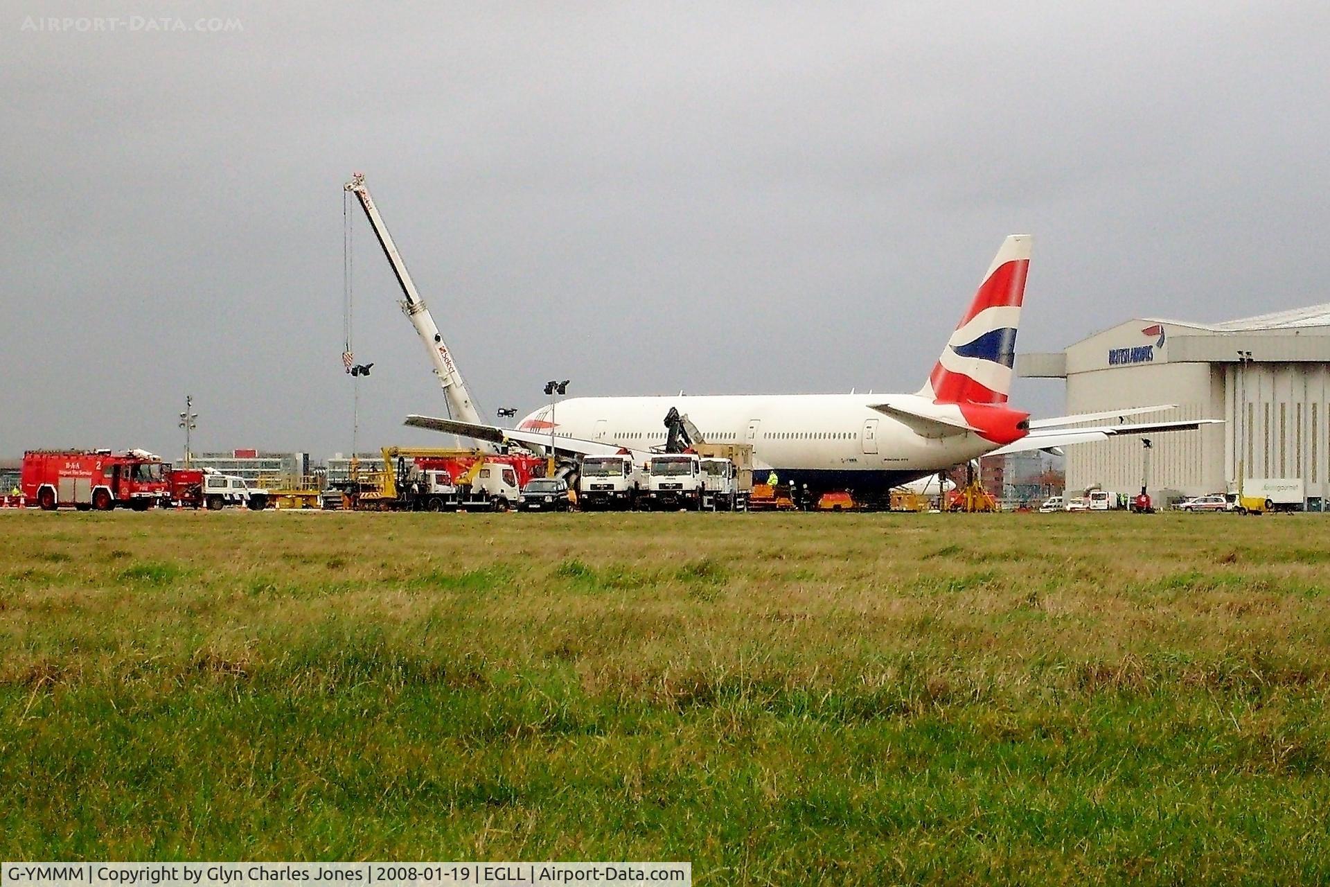 G-YMMM, 2001 Boeing 777-236/ER C/N 30314/342, Two days after the miraculous crash landing on 17th January 2008 whilst operating British Airways flight BA038 from Beijing and the crane has lifted the left wing. It has now been written off and broken up at London-Heathrow in 2009.