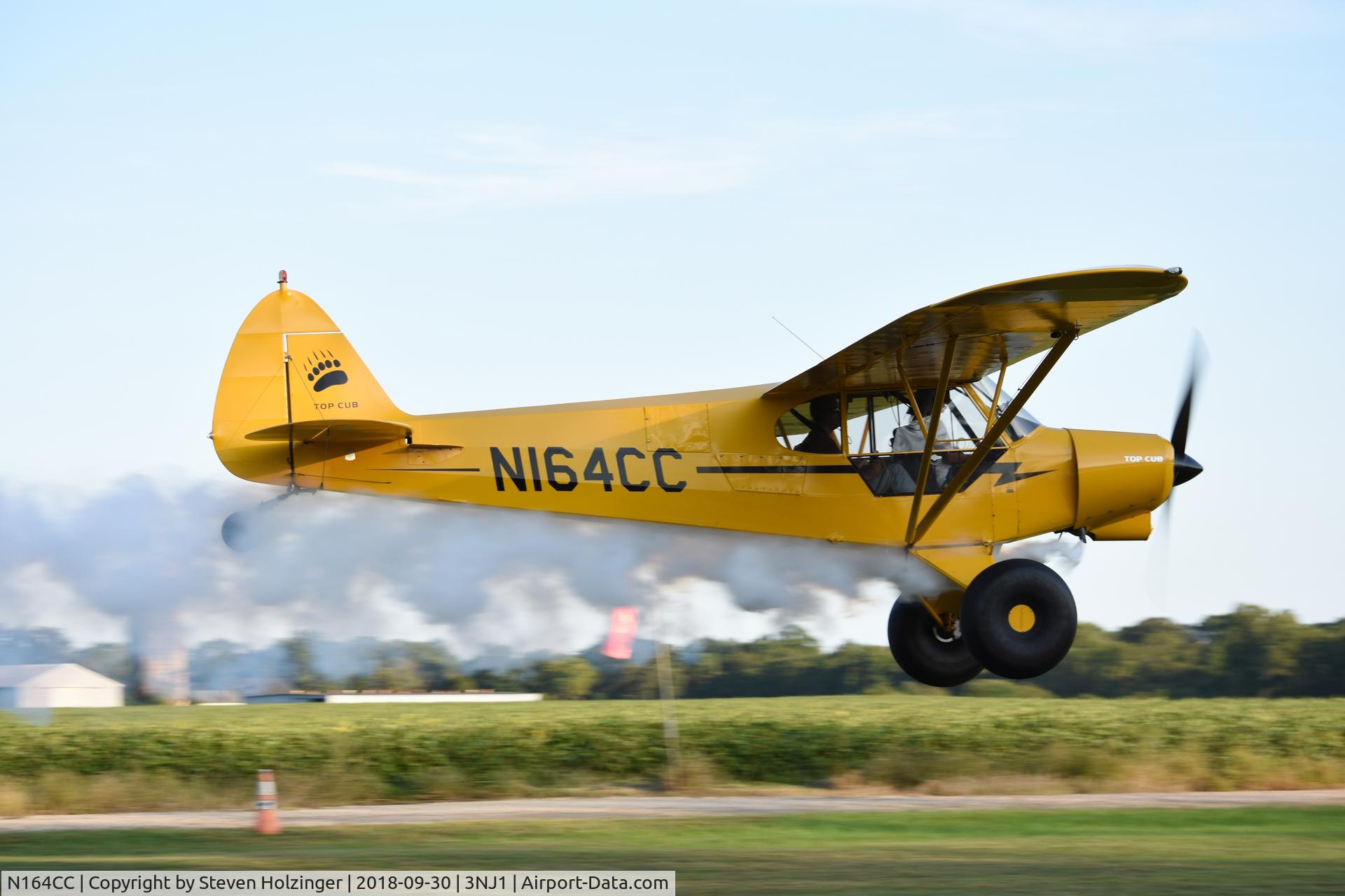 N164CC, Cub Crafters CC18-180 Top Club C/N CC18-0011, The owner of this beautiful Top Cub making a low pass with her smoke system on.