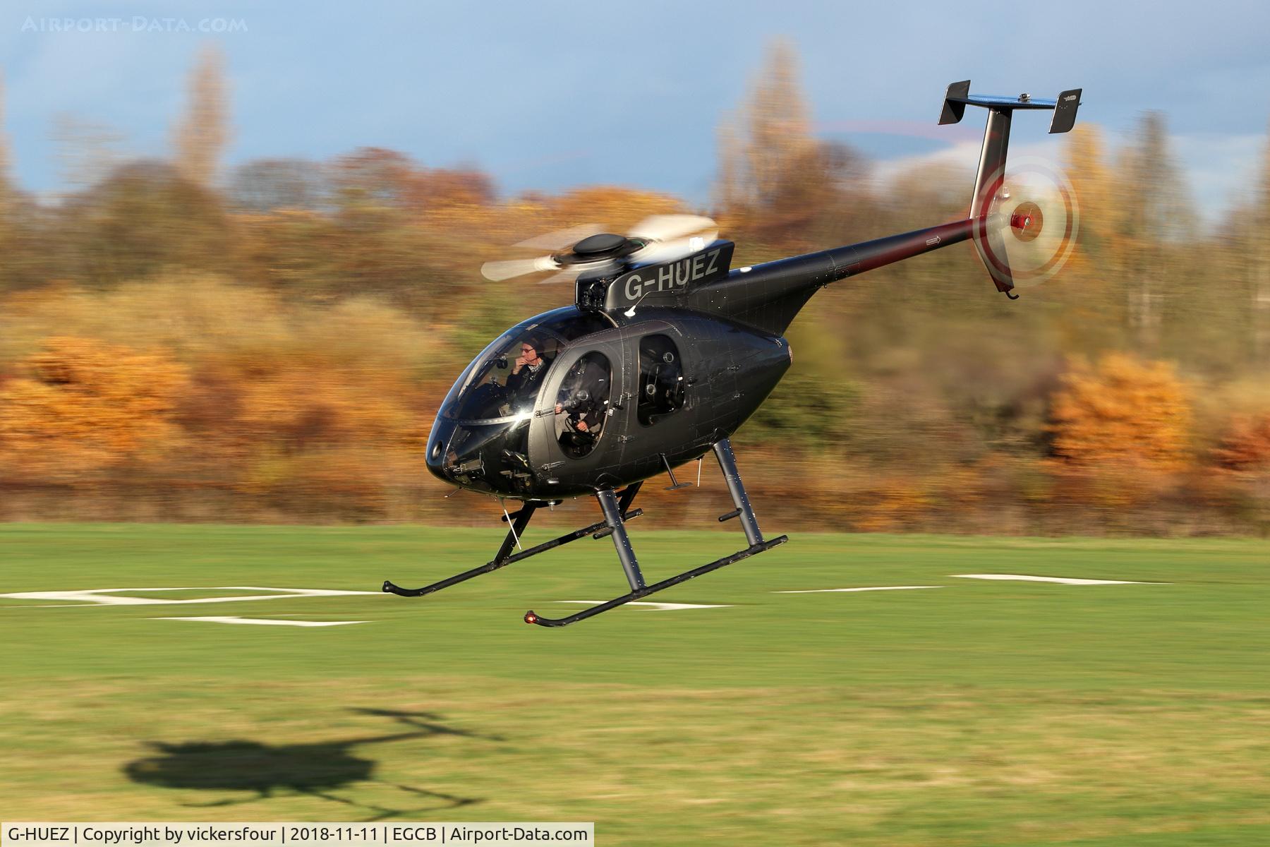 G-HUEZ, 1999 MD Helicopters 369E C/N 0544E, Departing Barton.