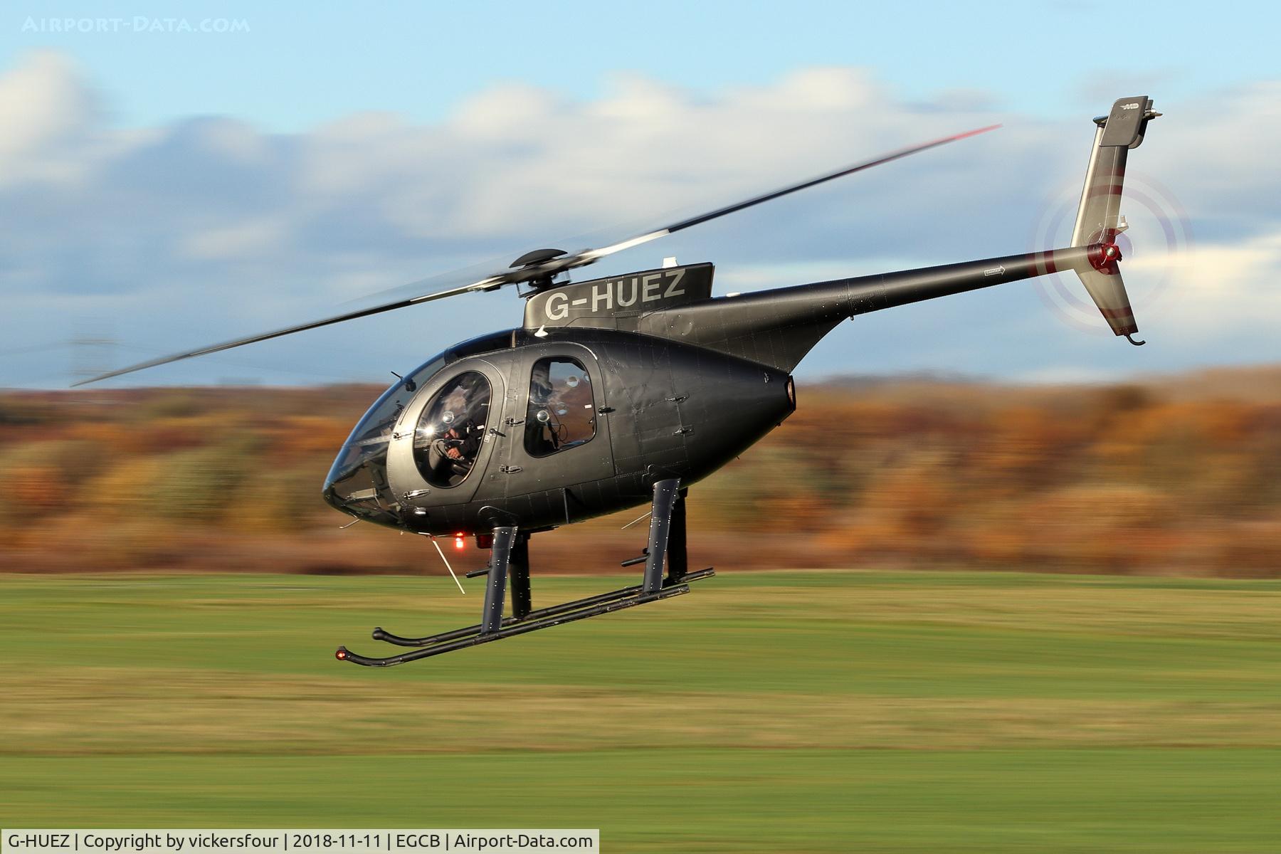 G-HUEZ, 1999 MD Helicopters 369E C/N 0544E, Departing Barton.