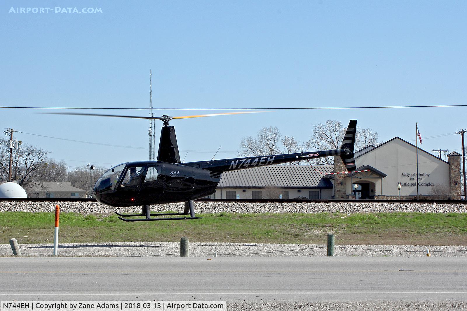 N744EH, 2015 Robinson R44 Raven II C/N 13883, Departing the roadside at Del Norte Tacos in Godley, Texas