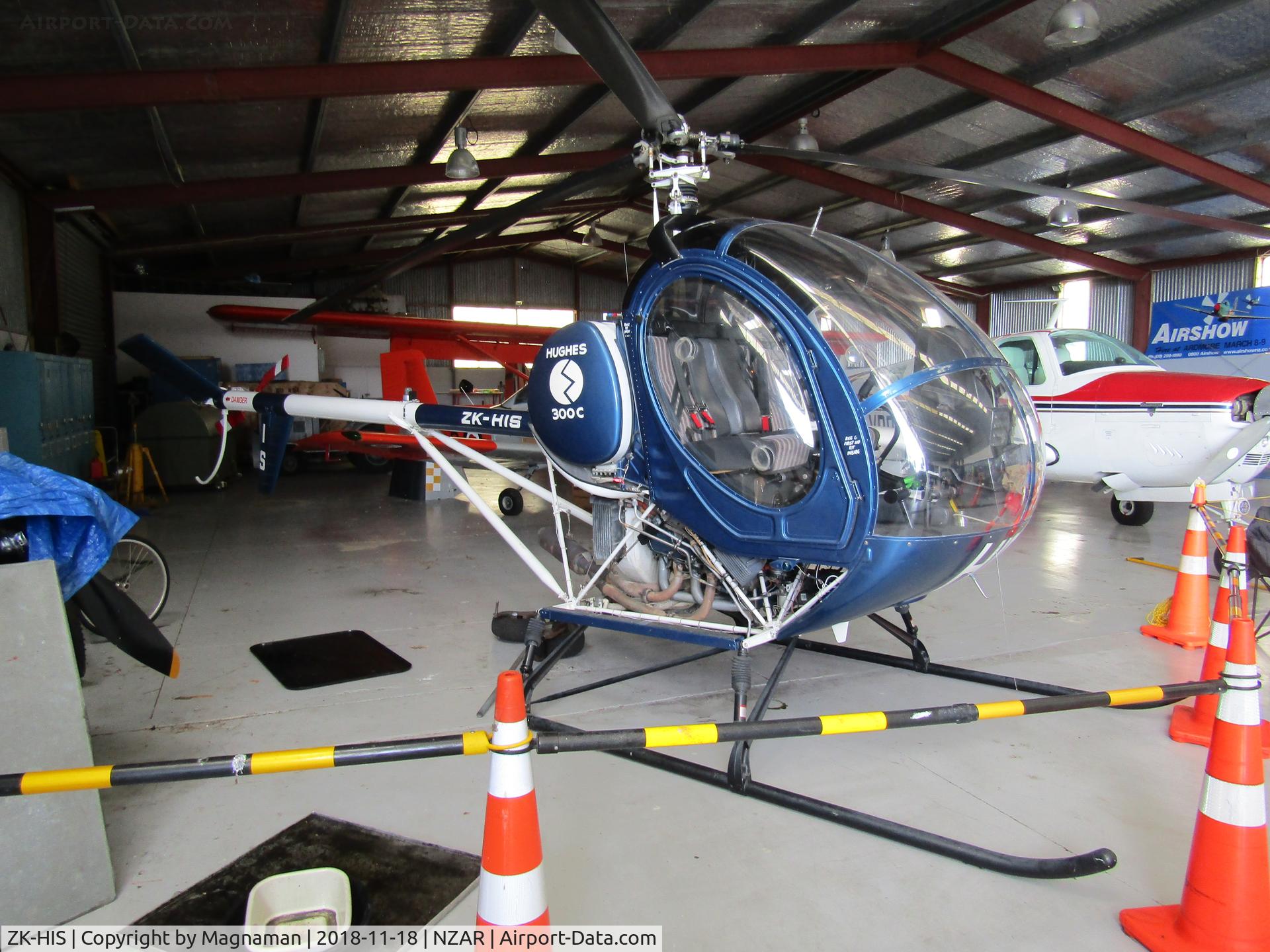 ZK-HIS, Hughes 269C C/N 1100994, hiding in warbird hangar at open day