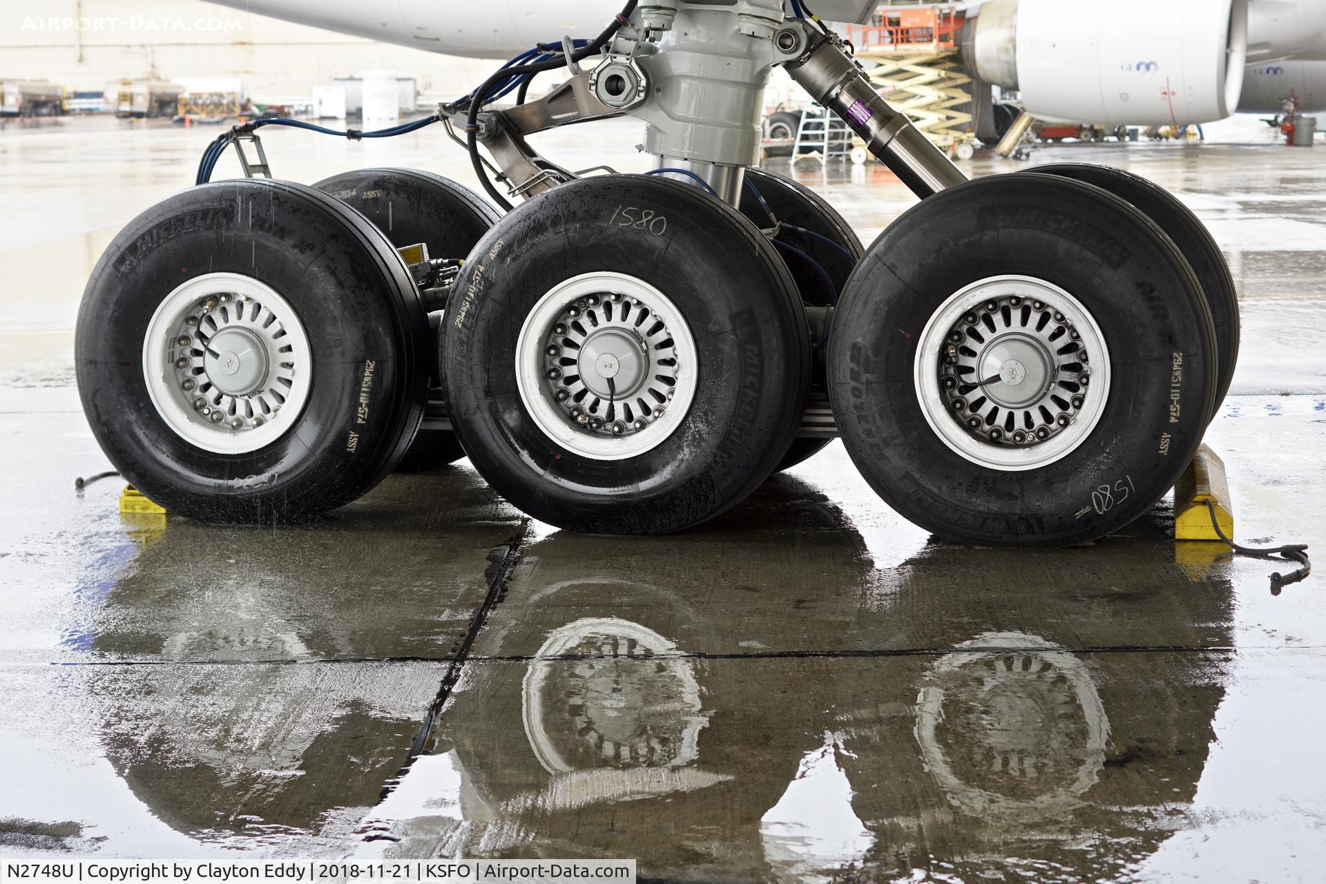 N2748U, 2018 Boeing 777-300/ER C/N 64994, First rain of the season. SFO 2018.