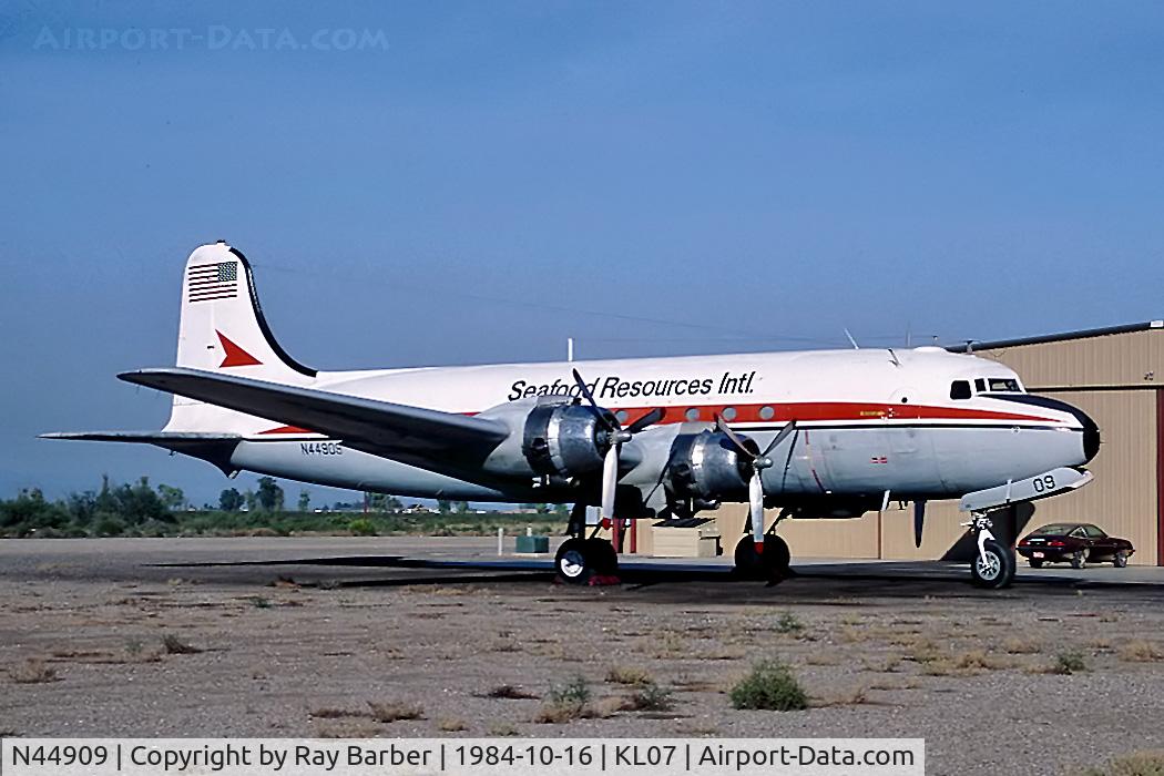 N44909, Douglas C54E-DC C/N 27371, N44909   Douglas C-54R-15-DO Skymaster [27371] (Seafood Resources Intl) Chandler-Memorial Airfield~N 16/10/1984
