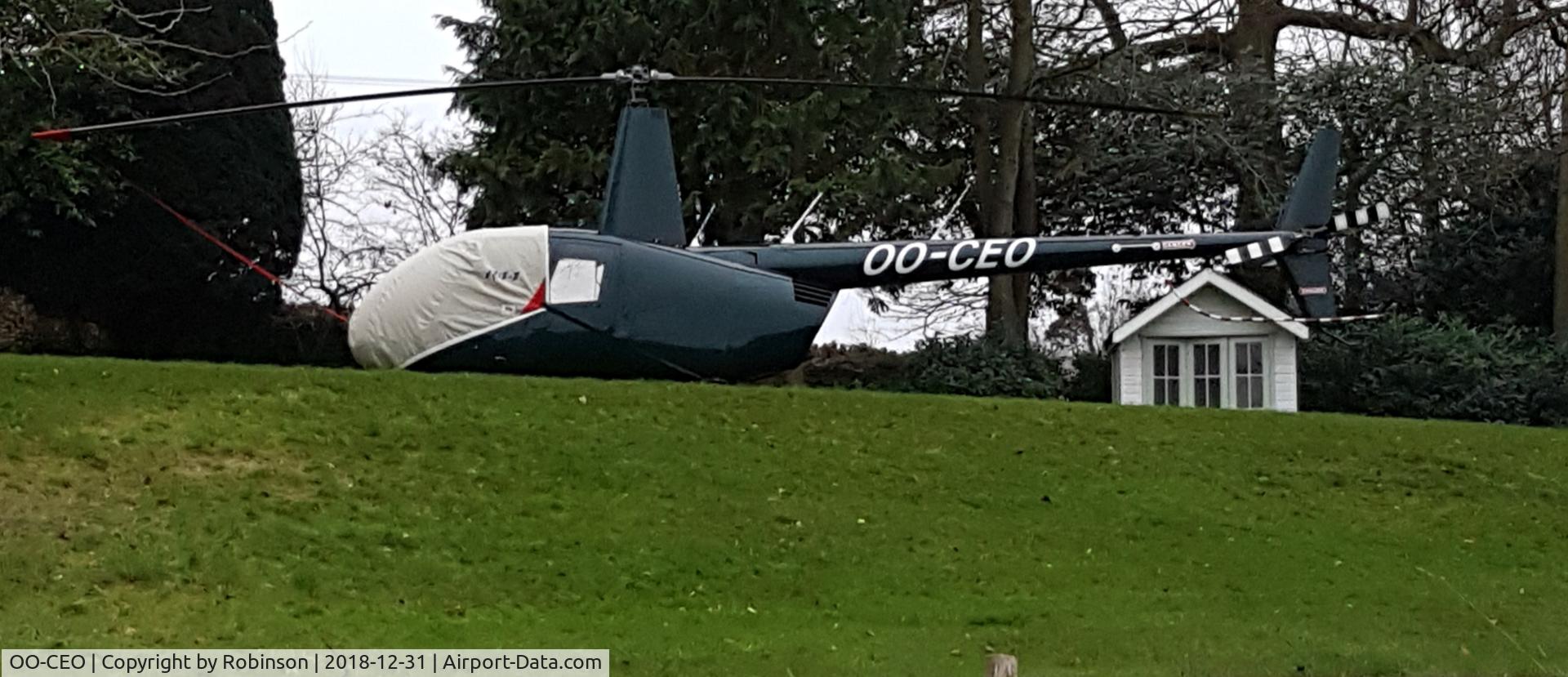 OO-CEO, 2005 Robinson R44  Raven C/N 10745, Seen in the garden on New Year's Eve.