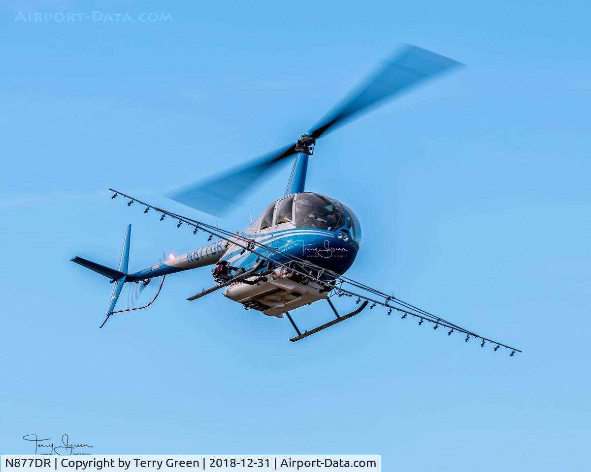 N877DR, 2008 Robinson R44 II C/N 12520, Central Valley Helicopters N877DR 2008 Robinson R44 II C/N 12520 doing aerial spraying in a field west of the intersection of Calhoun Road & Bradshaw Road, Skagit Valley, Skagit County Washington